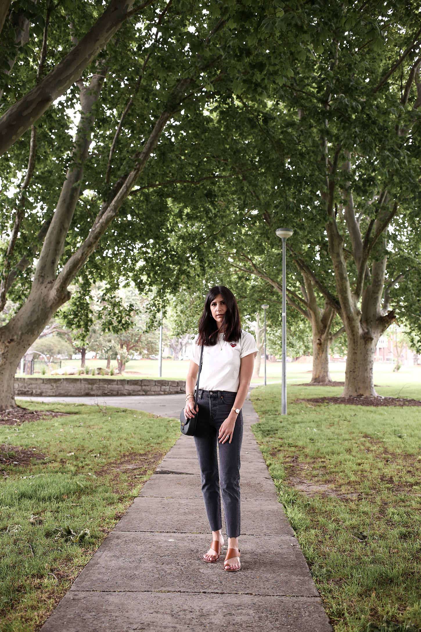 Minimal Outfit of a white tee and faded black denim