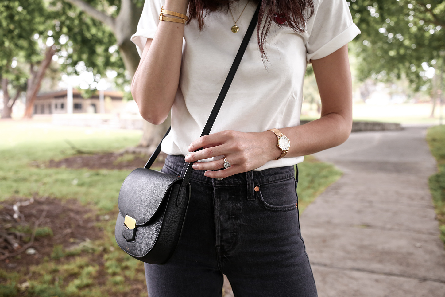 Minimal Outfit of a white tee and faded black denim