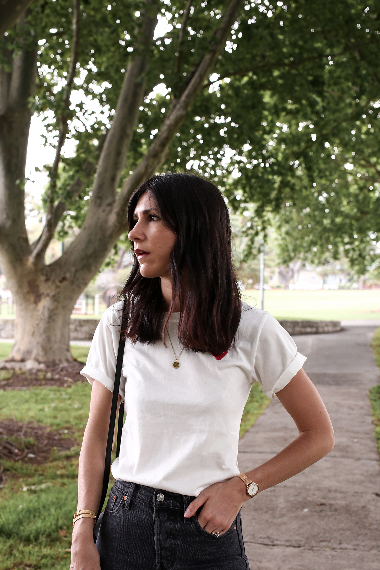 Minimal Outfit of a white tee and faded black denim