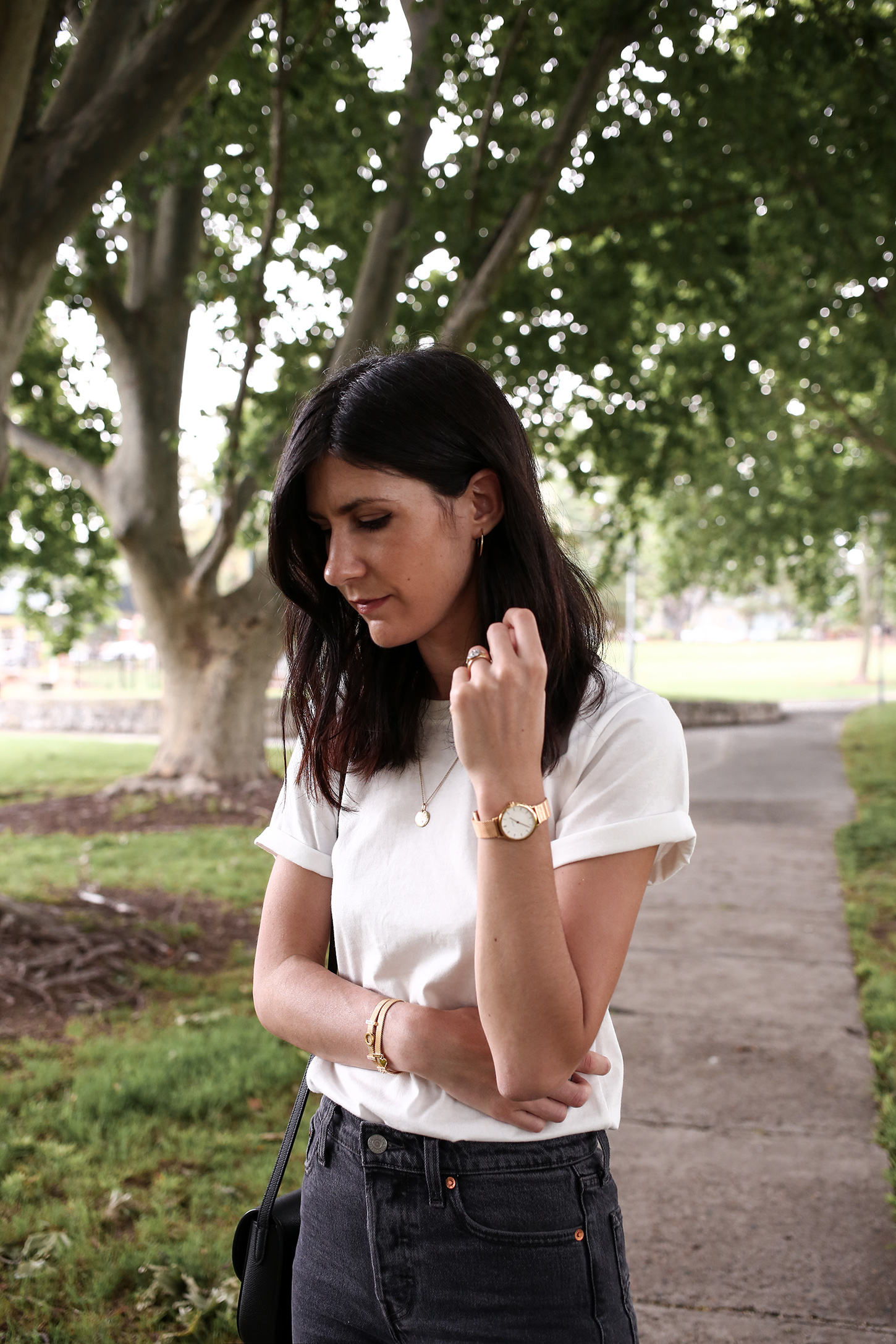 Minimal Outfit of a white tee and faded black denim