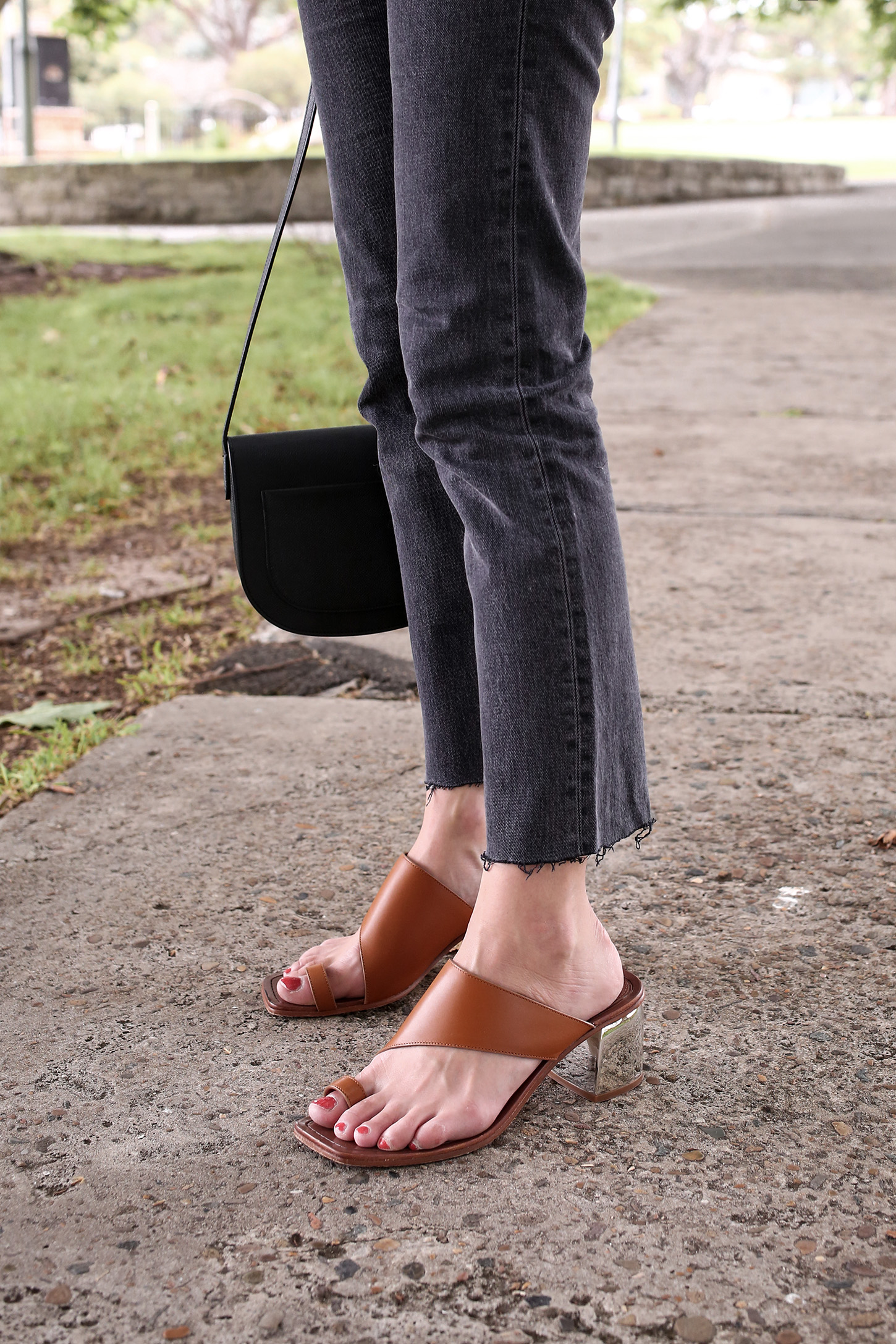 Minimal Outfit of a white tee and faded black denim