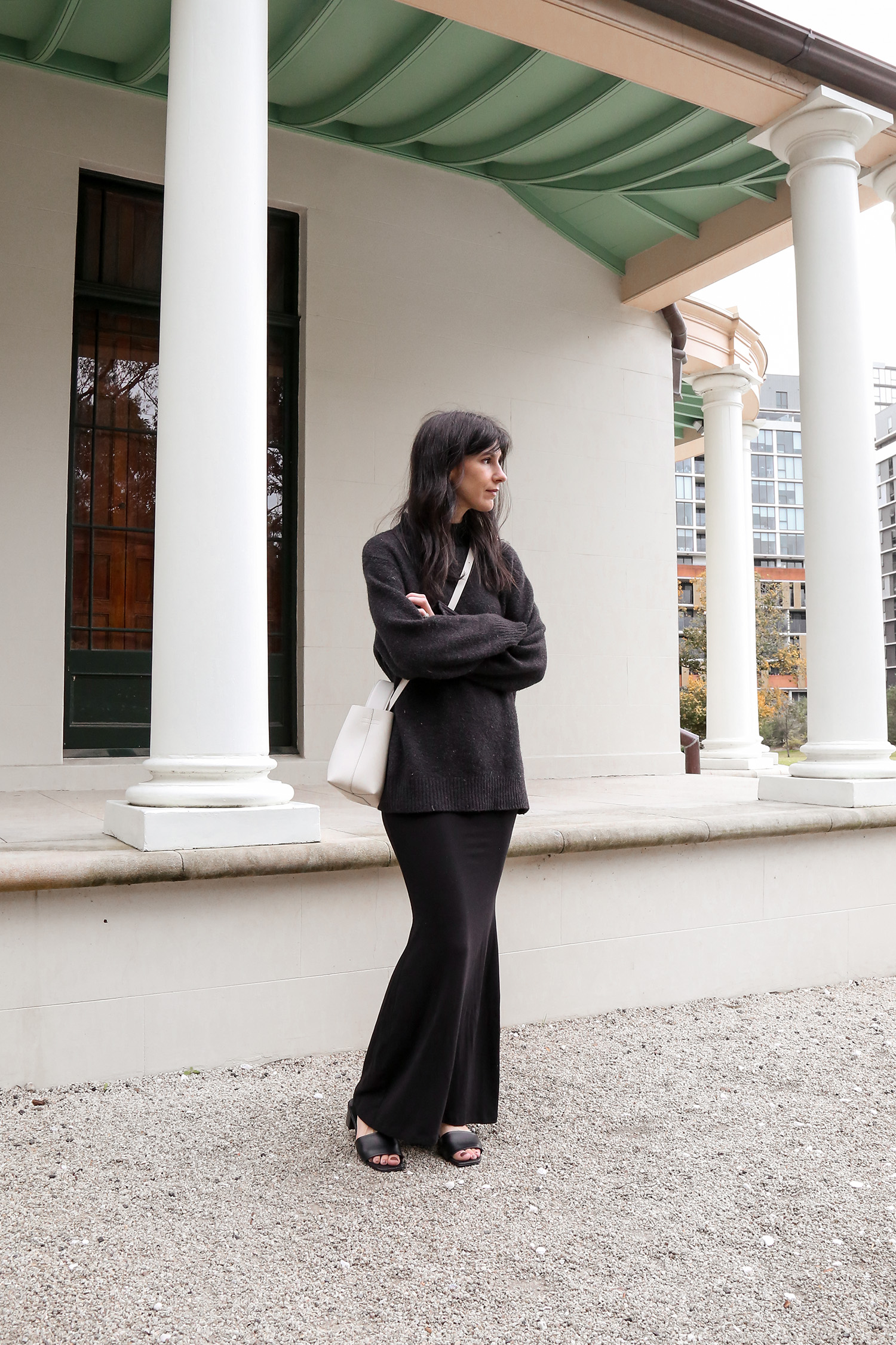 All black outfit with white handbag