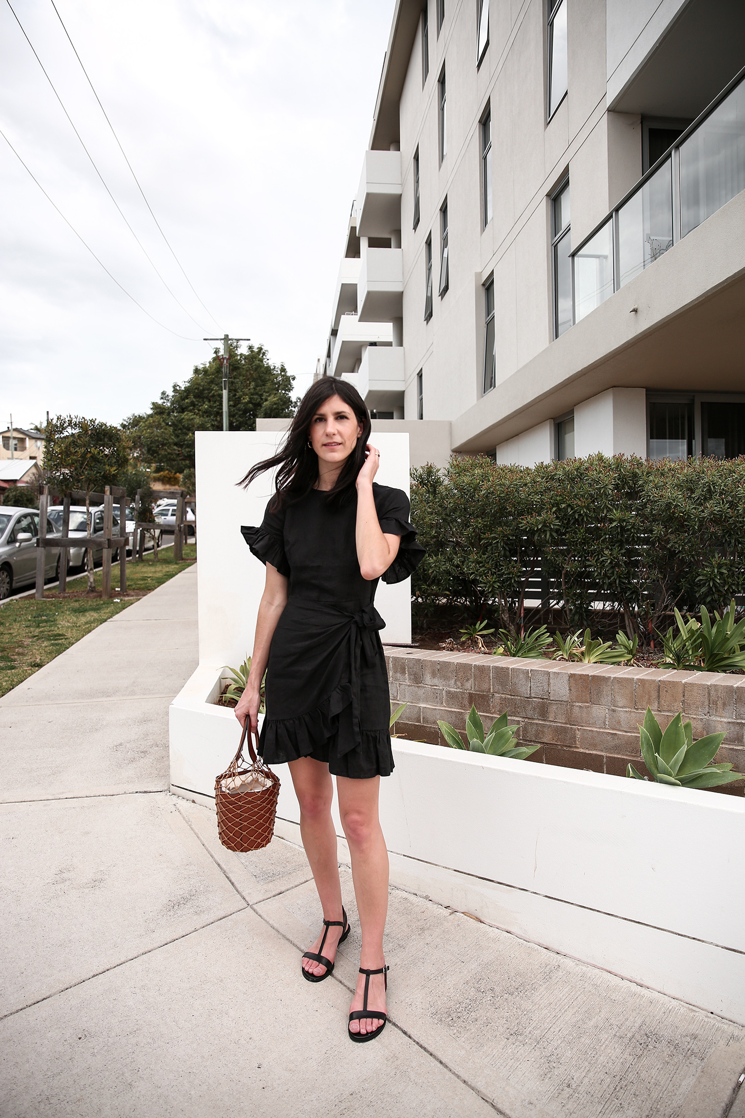 Outfit wearing black ruffle dress