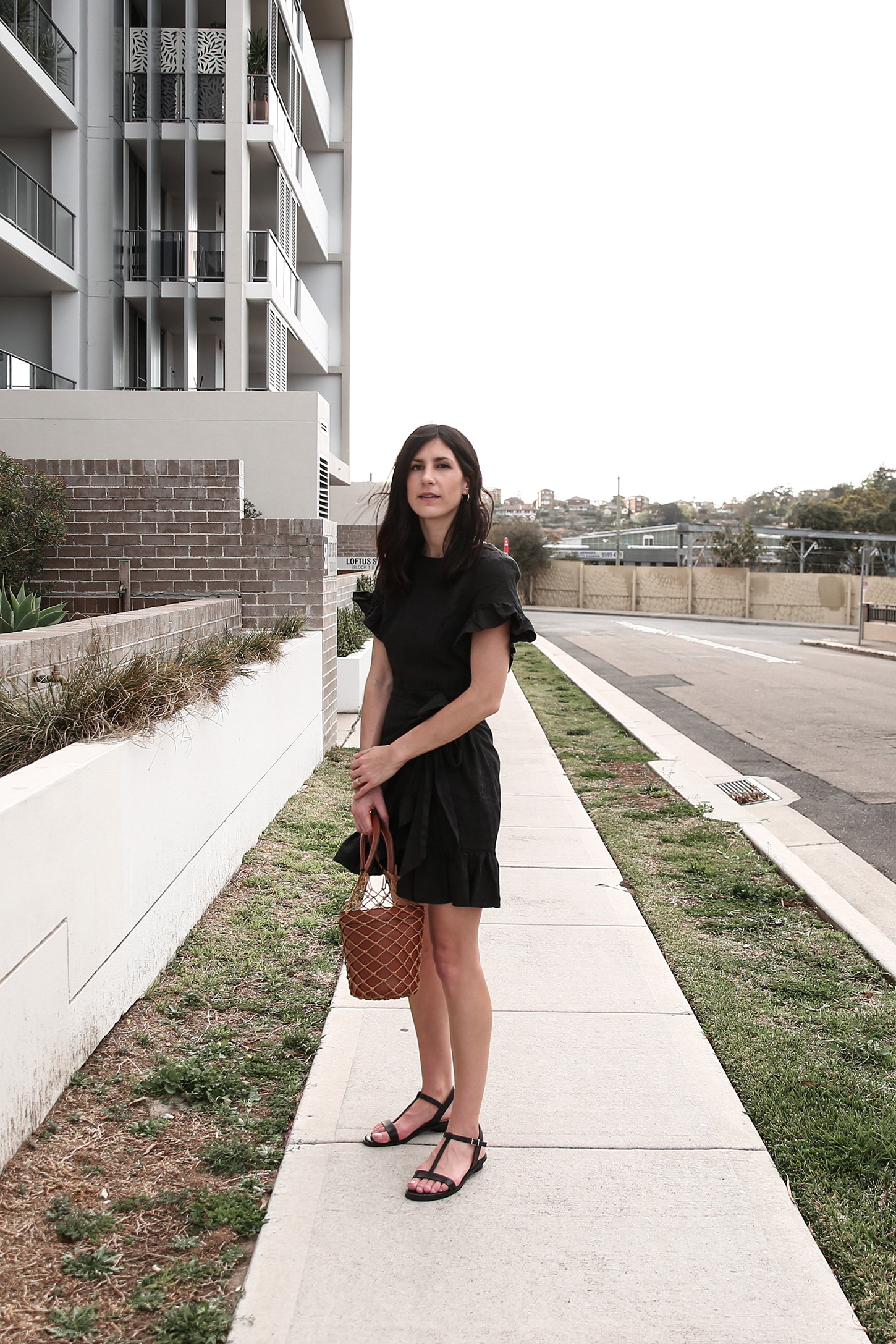 Outfit wearing black ruffle dress