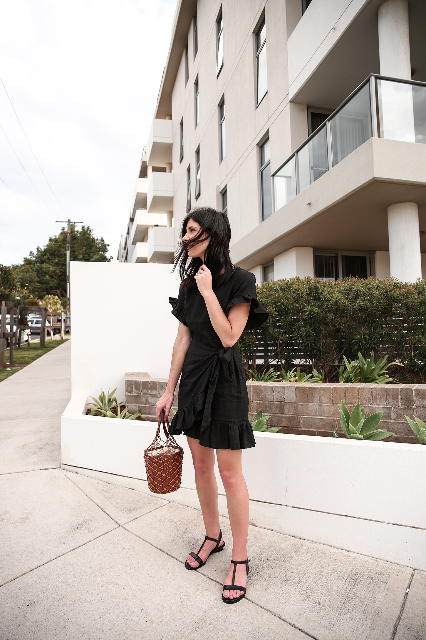 Outfit wearing black ruffle dress