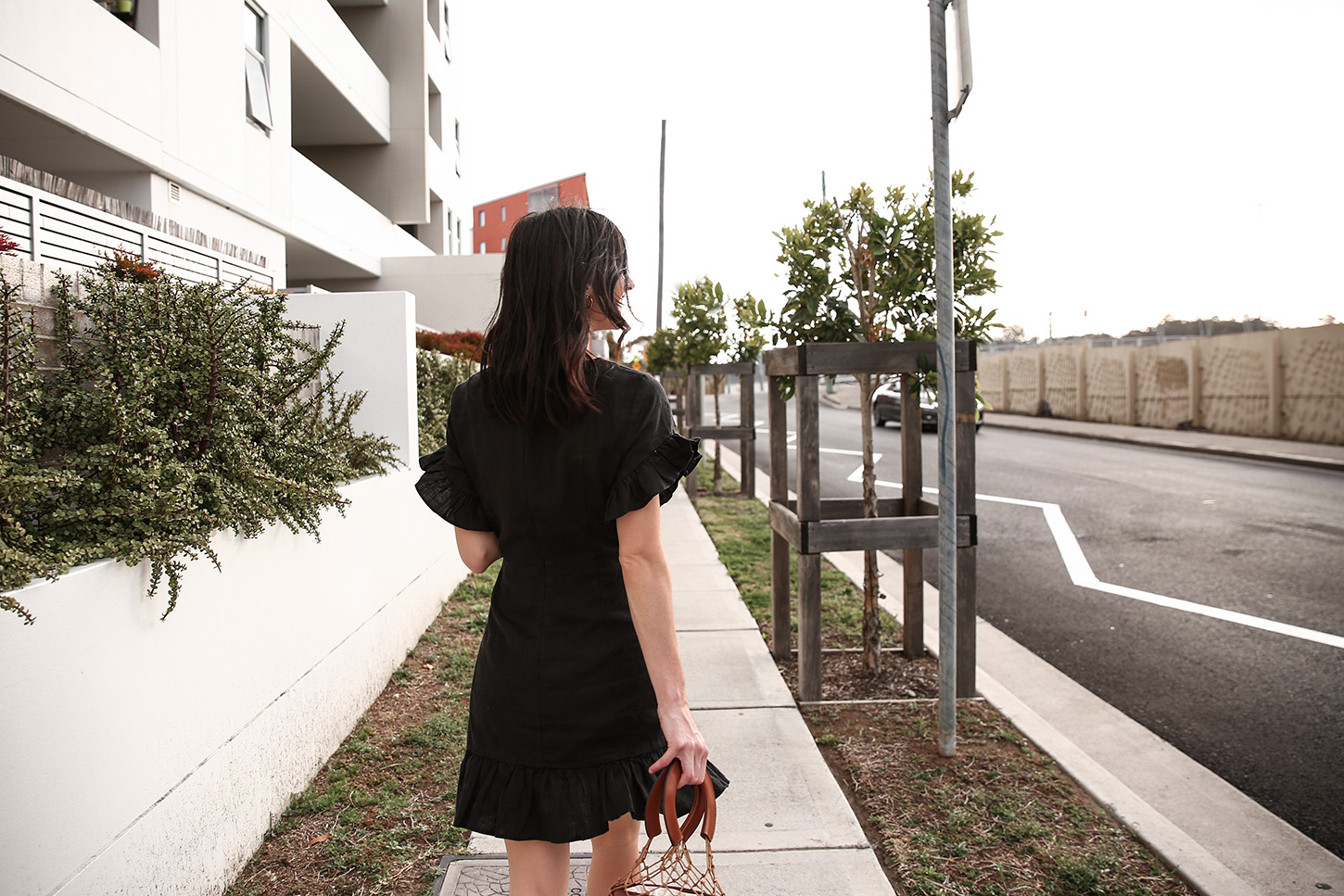 Outfit wearing black ruffle dress