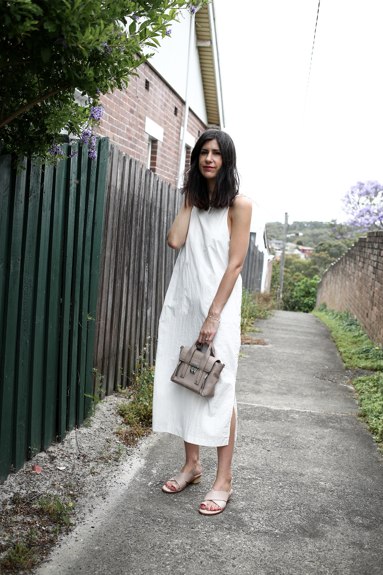 Minimal Outfit wearing white dress and nude mules