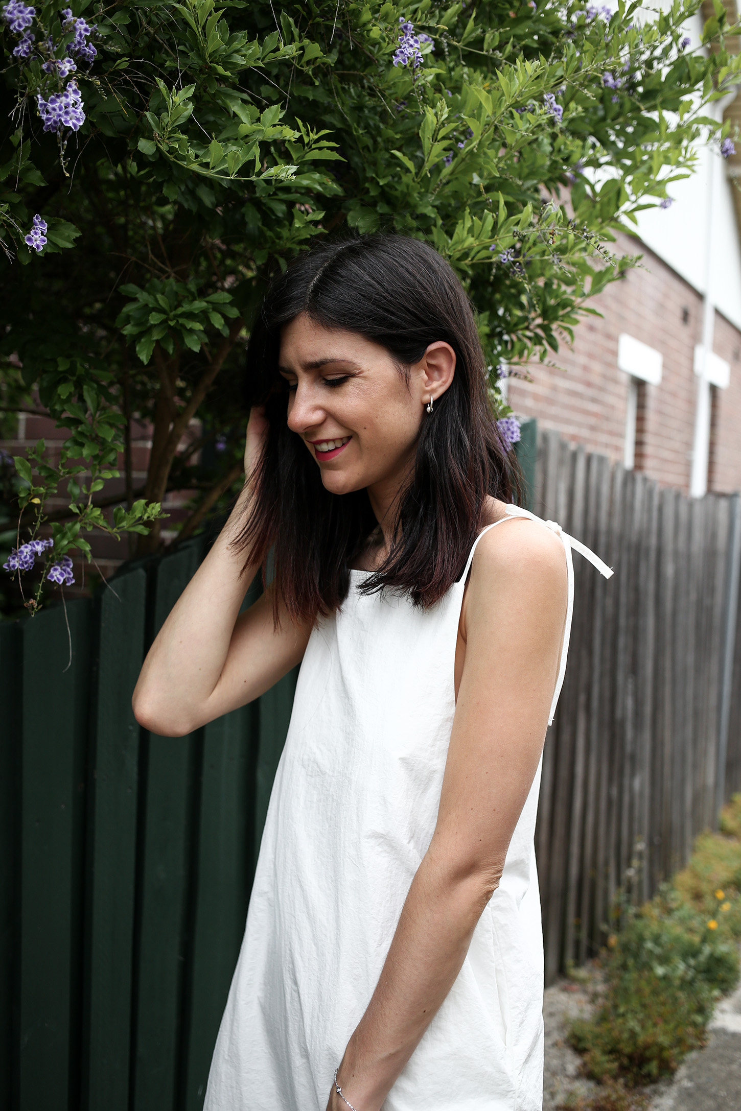 Minimal Outfit wearing white dress and nude mules