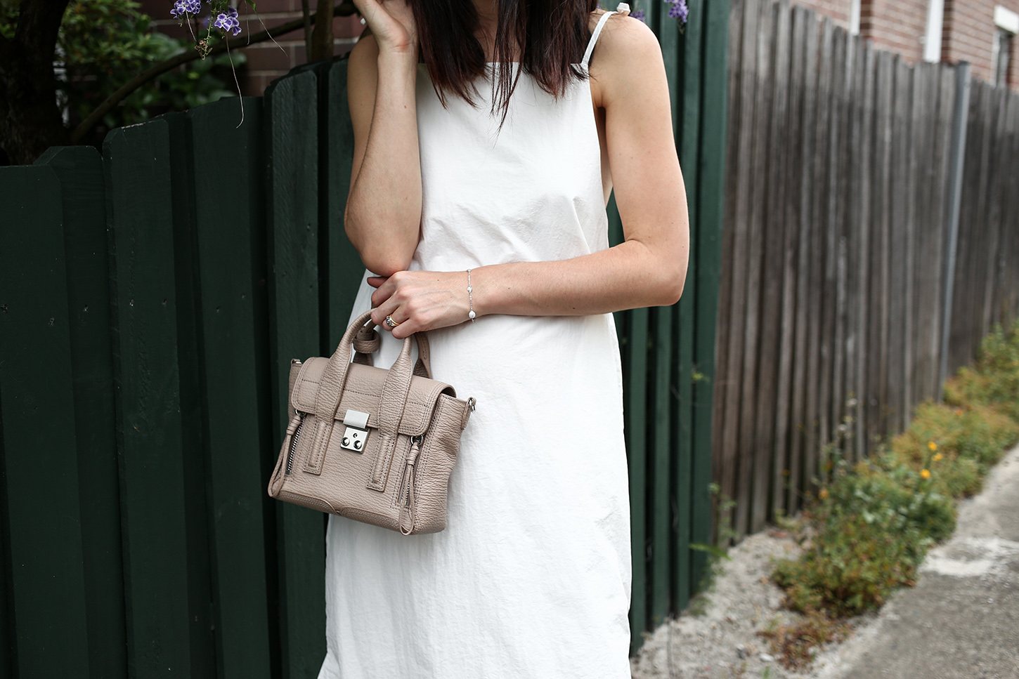Minimal Outfit wearing white dress and nude mules