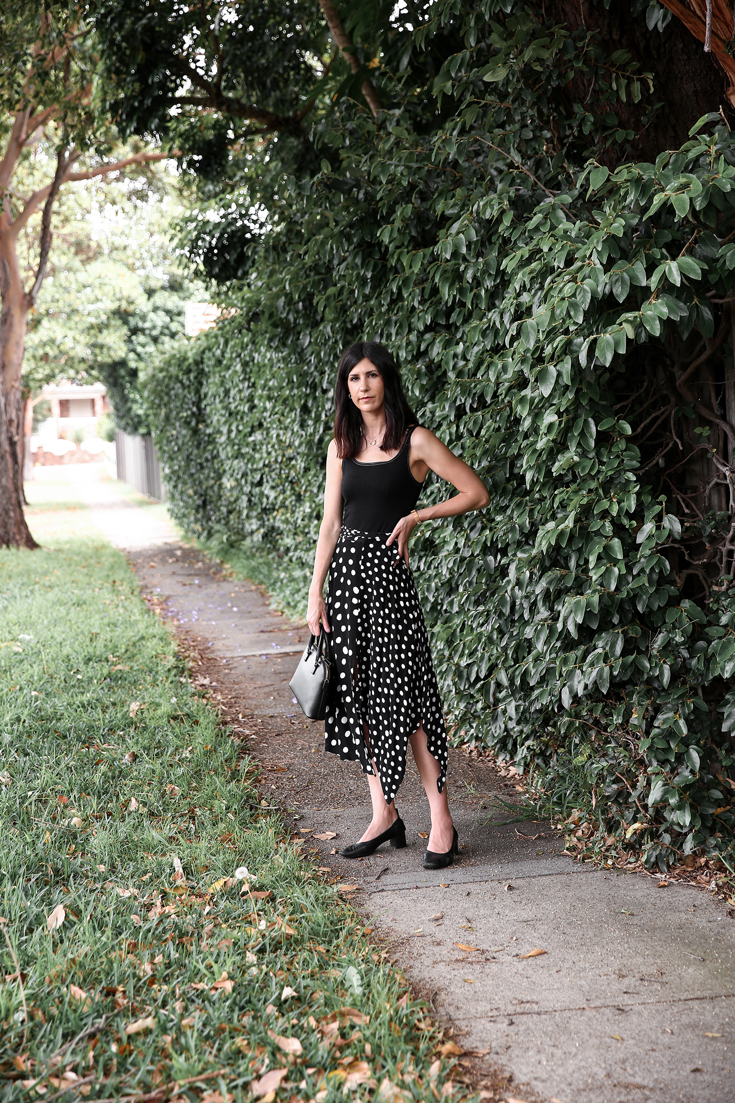 Minimal Outfit wearing Topshop polka dot skirt