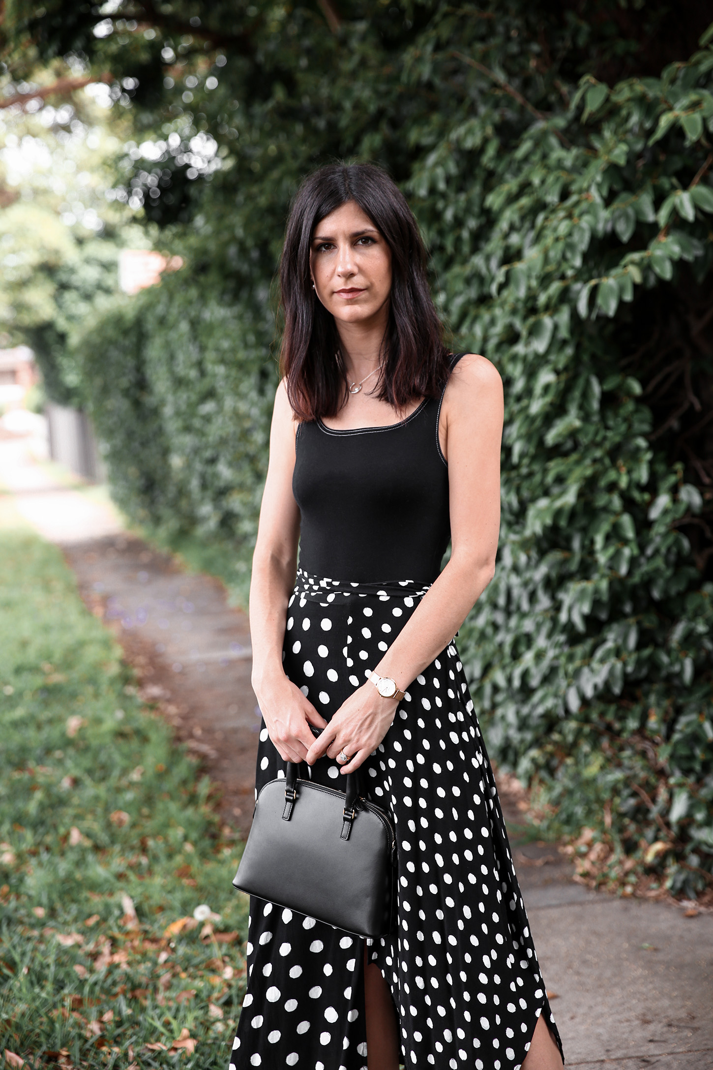 Minimal Outfit wearing Topshop polka dot skirt