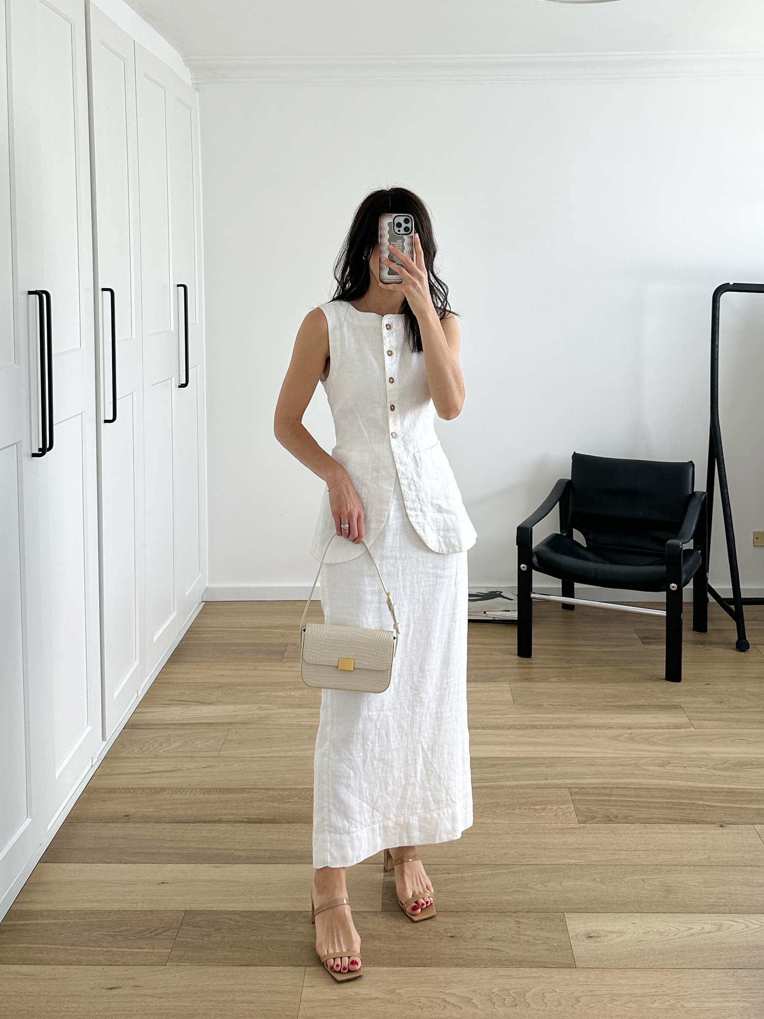 Wearing Posse Emma Vest and Emma Skirt with By Far Tanya Mules and The Curated Mini Shoulder Bag