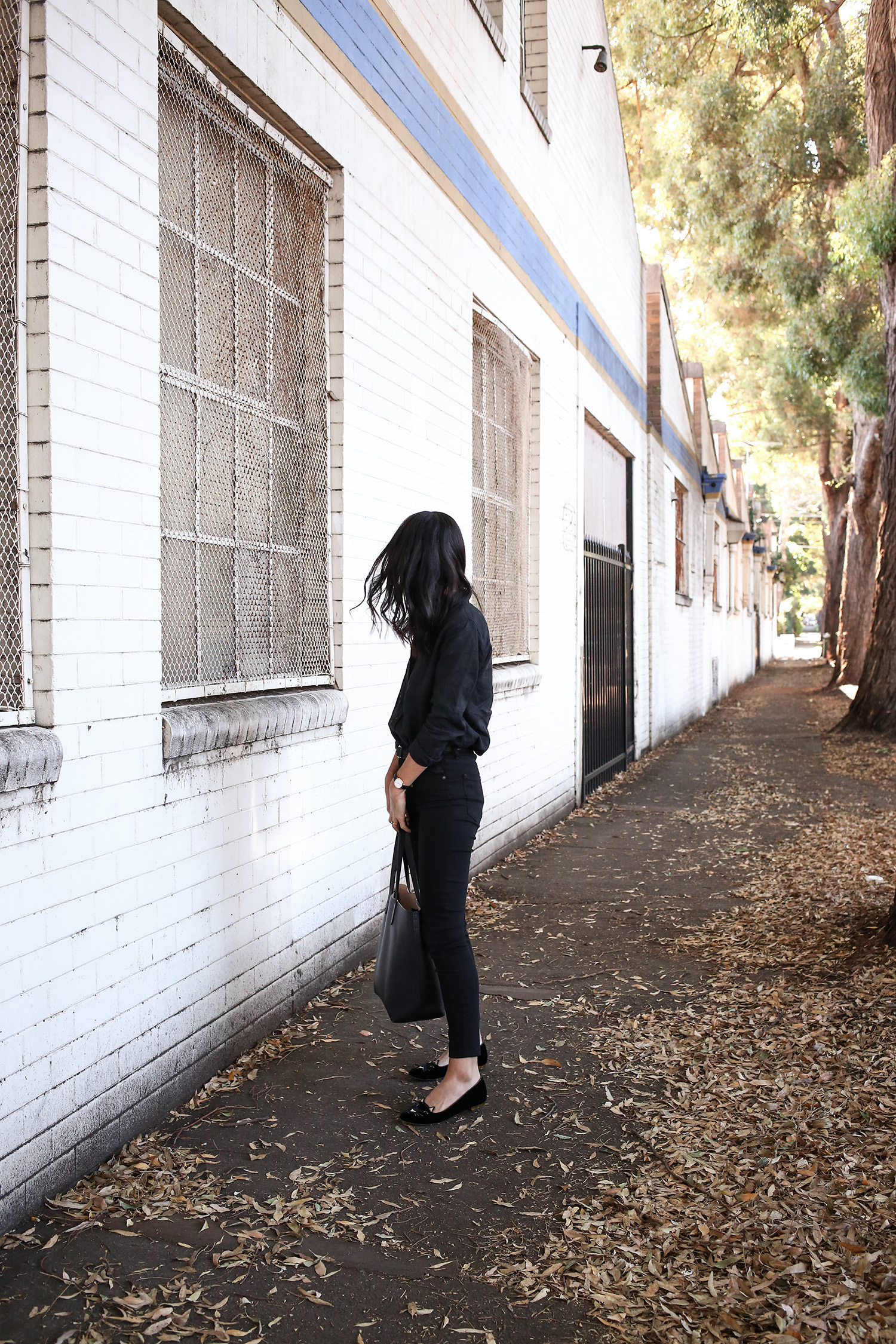 Jamie Lee of Mademoiselle wearing an all black minimal style outfit