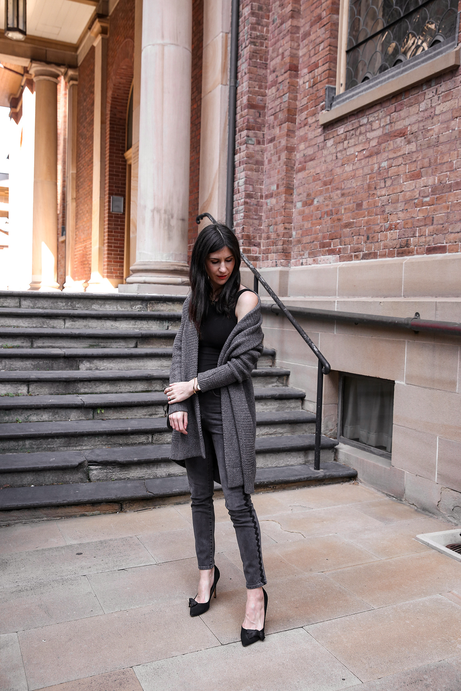 Jamie Lee of Mademoiselle wearing a head to toe black outfit