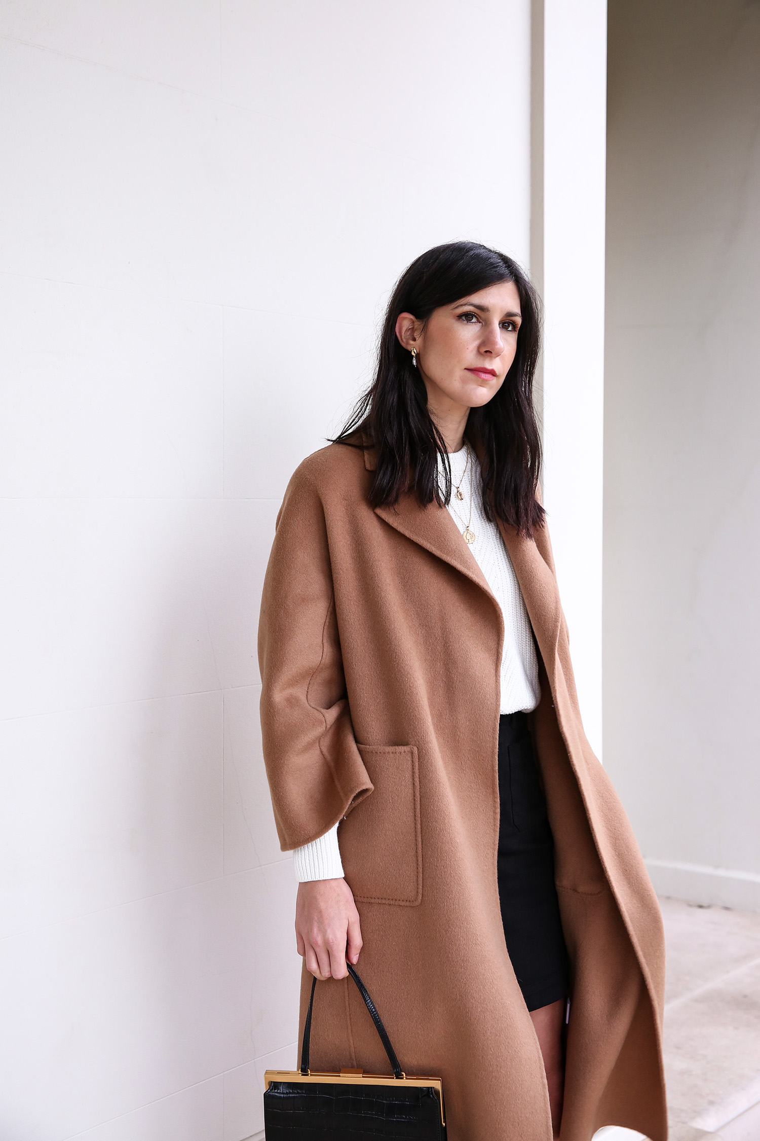 Jamie Lee of Mademoiselle wearing a minimal outfit and Shop The Curated camel coat