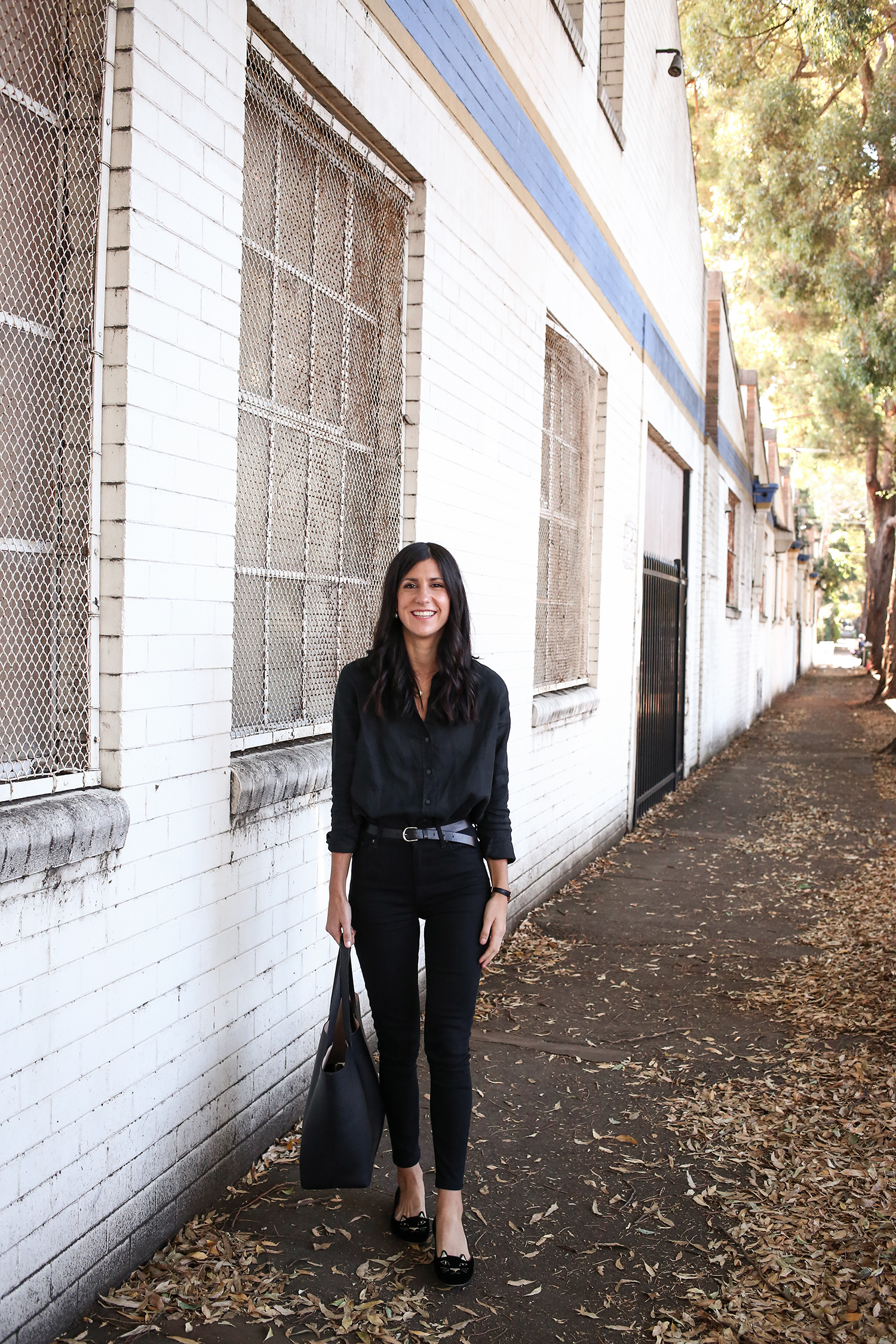 Outfit wearing Everlane linen shirt and Reformation skinny jeans