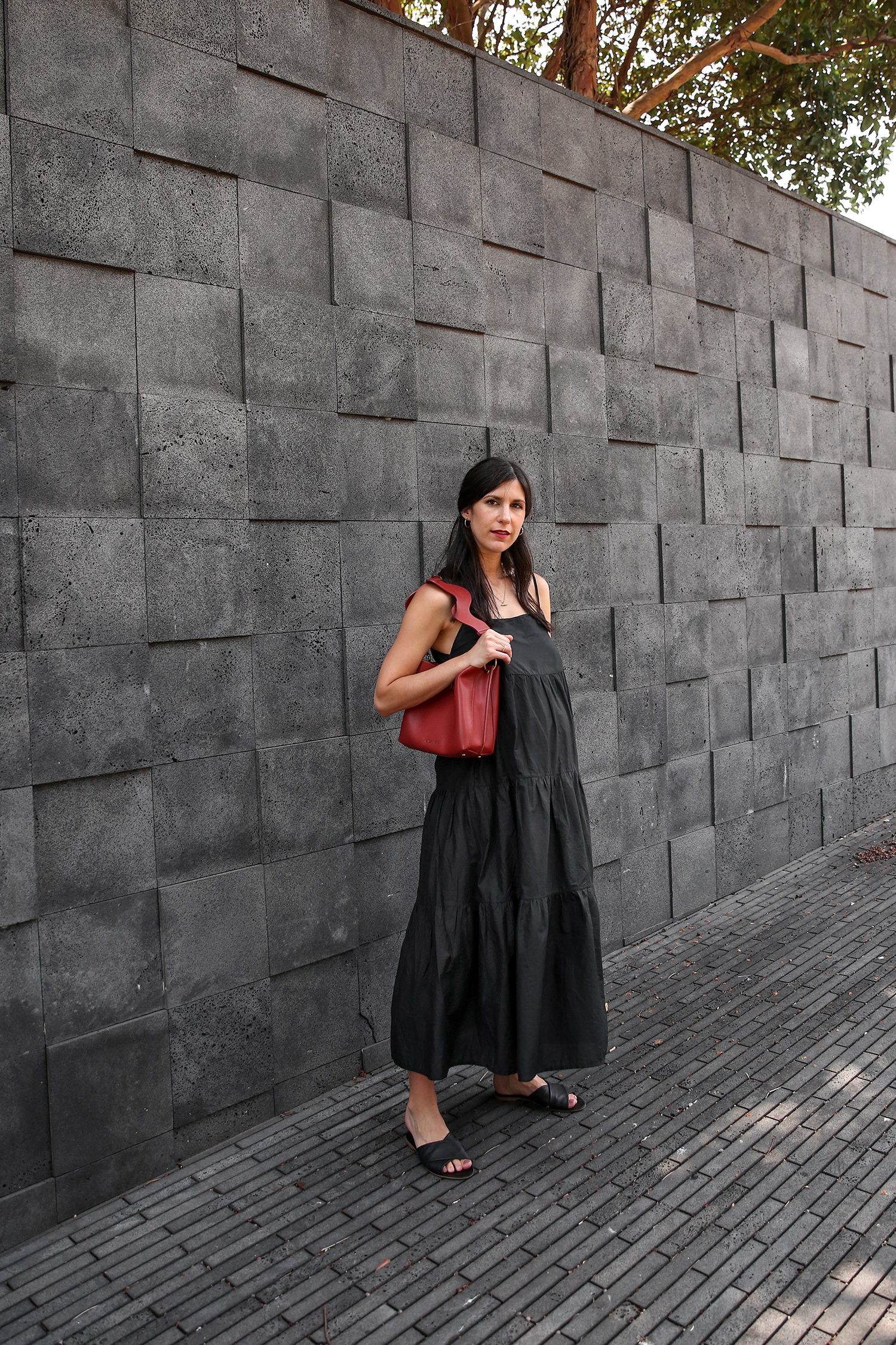 Jamie Lee of Mademoiselle wearing Matteau black cotton tiered dress