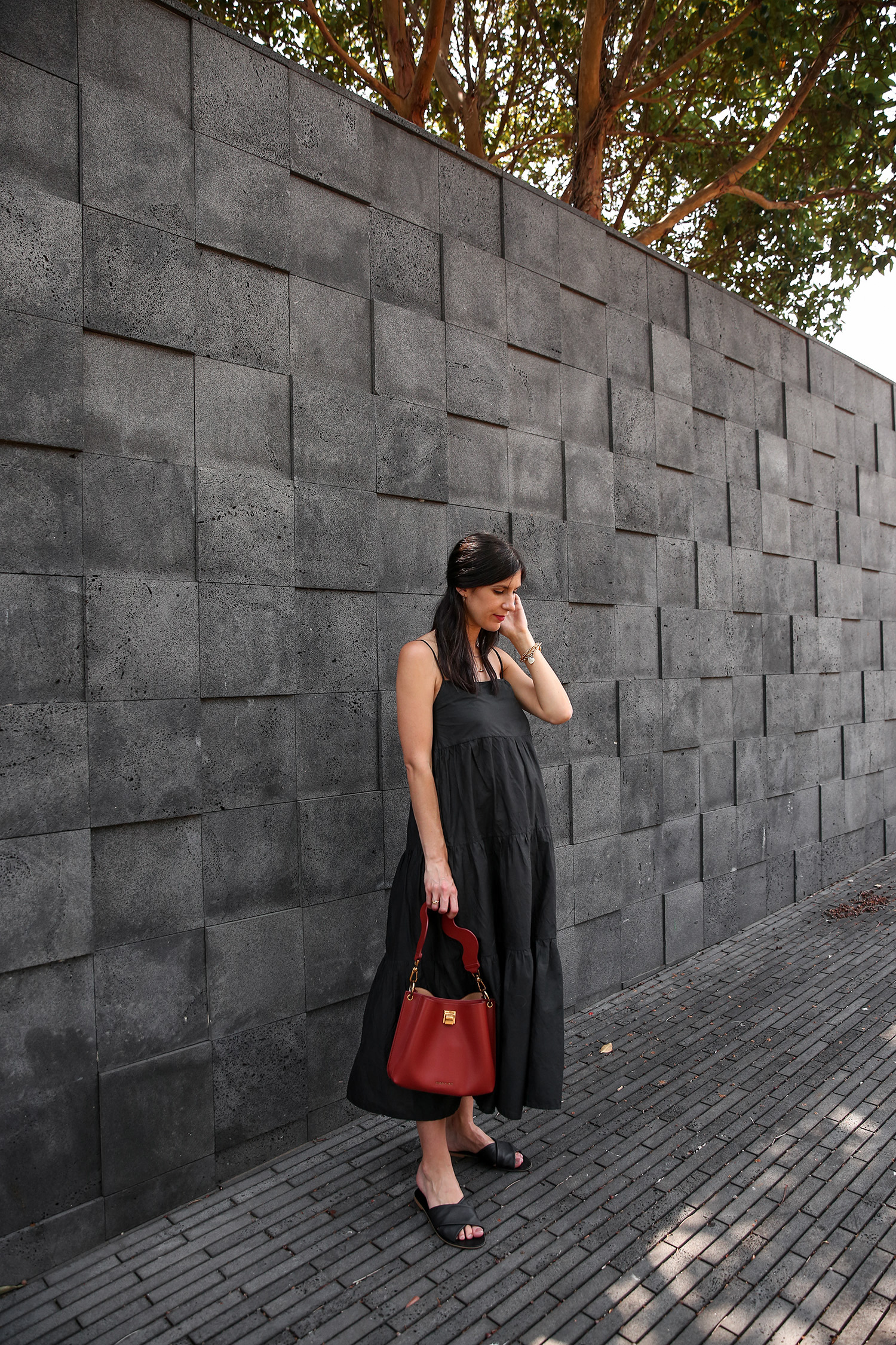 Jamie Lee of Mademoiselle wearing Matteau black cotton tiered dress