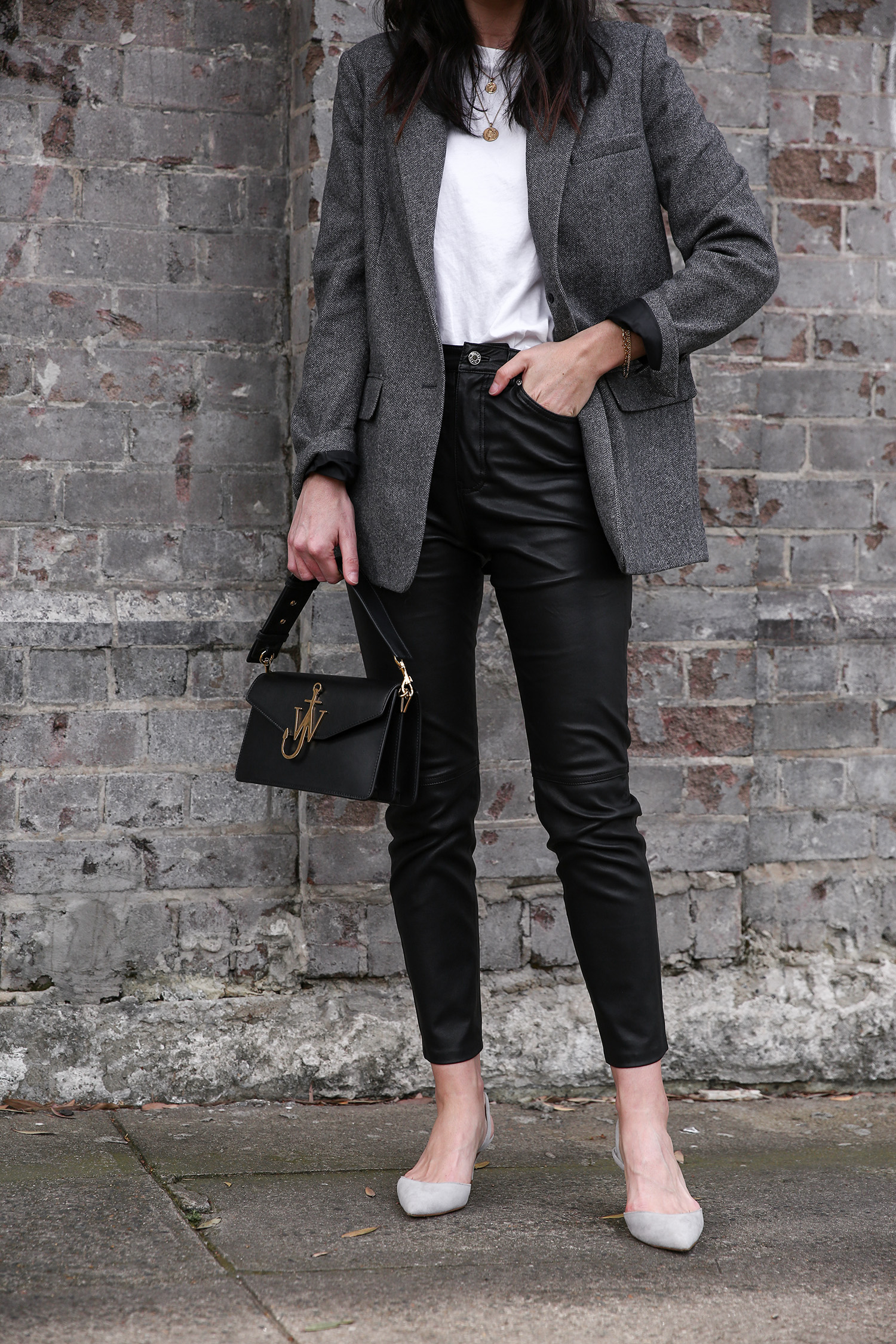 Jamie Lee of Mademoiselle wearing the Everlane oversized blazer and GRLFRND Denim leather trousers