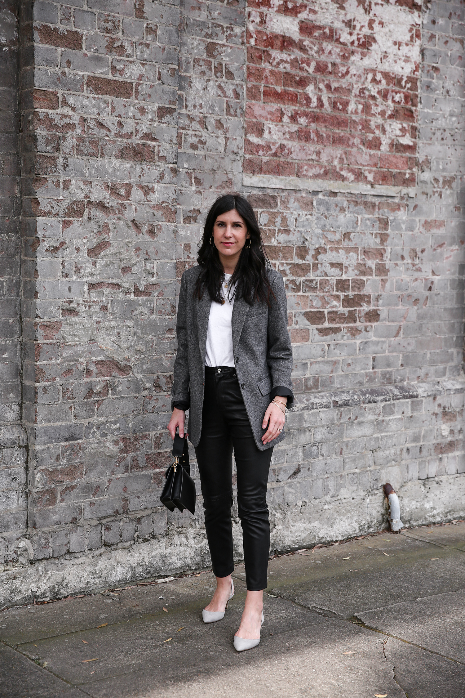 Jamie Lee of Mademoiselle wearing the Everlane oversized blazer and GRLFRND Denim leather trousers