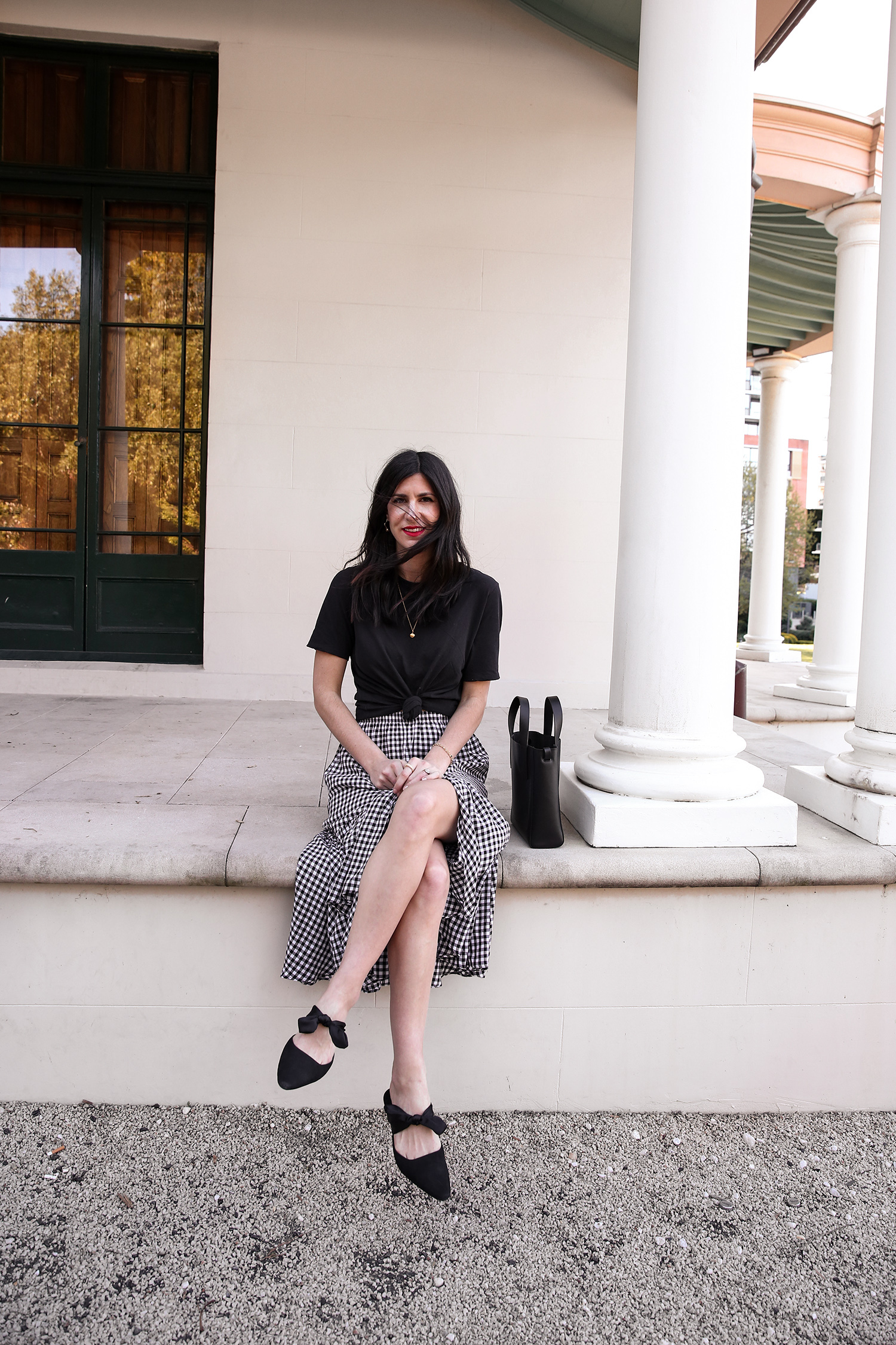 Jamie Lee of Mademoiselle wearing a knotted tee and gingham skirt minimal style