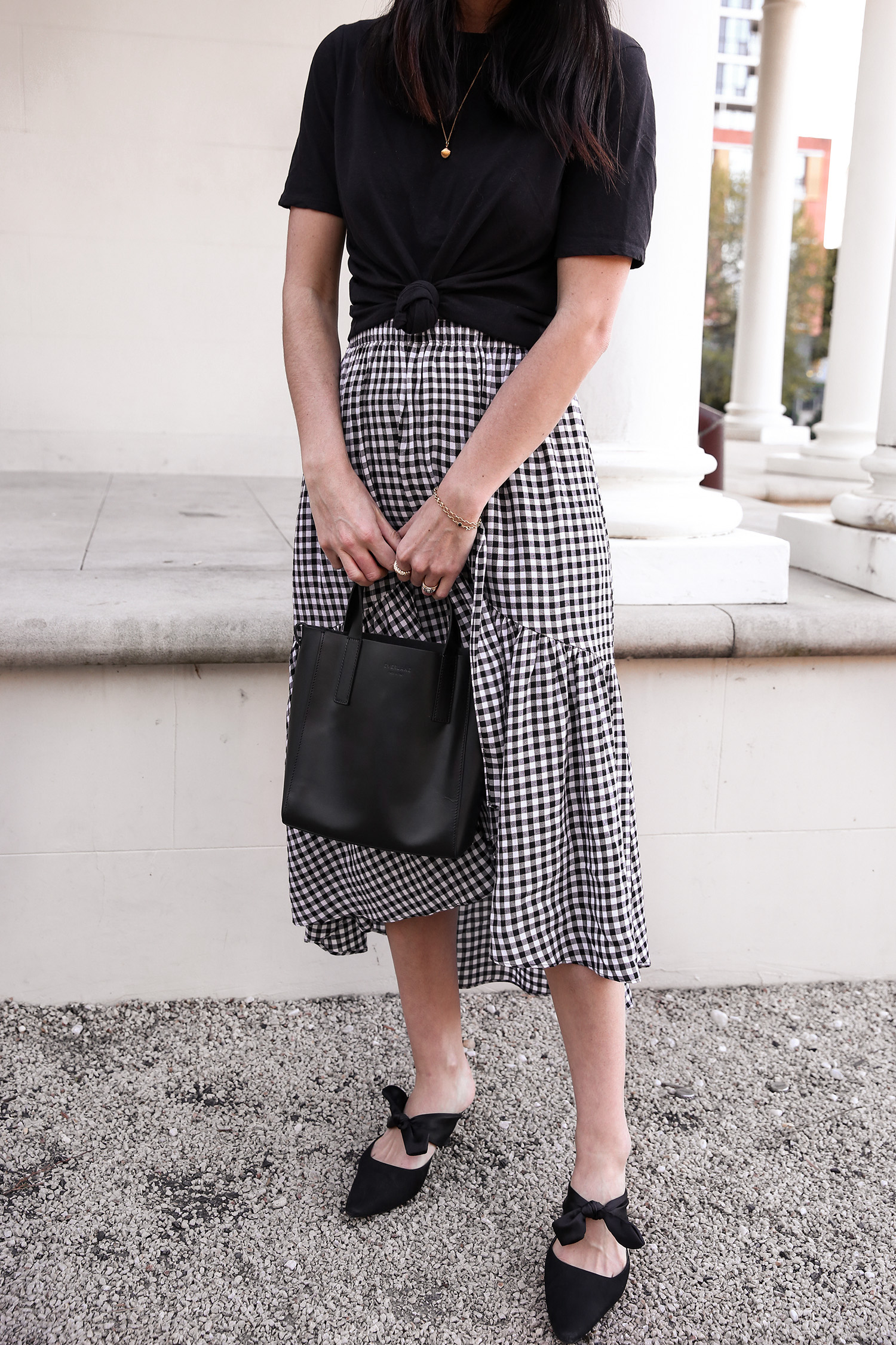 Jamie Lee of Mademoiselle wearing a knotted tee and gingham skirt minimal style