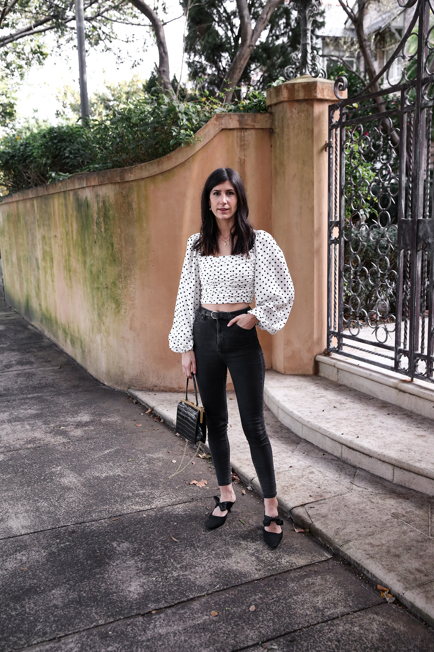 Jamie Lee of Mademoiselle wearing a polka dot top and skinny jeans