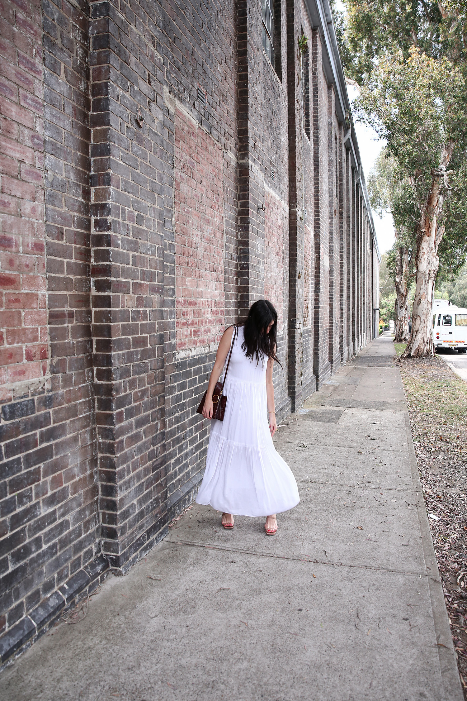 Jamie Lee of Mademoiselle wearing the Lune Resort Noni Maxi Dress and By Far Mules