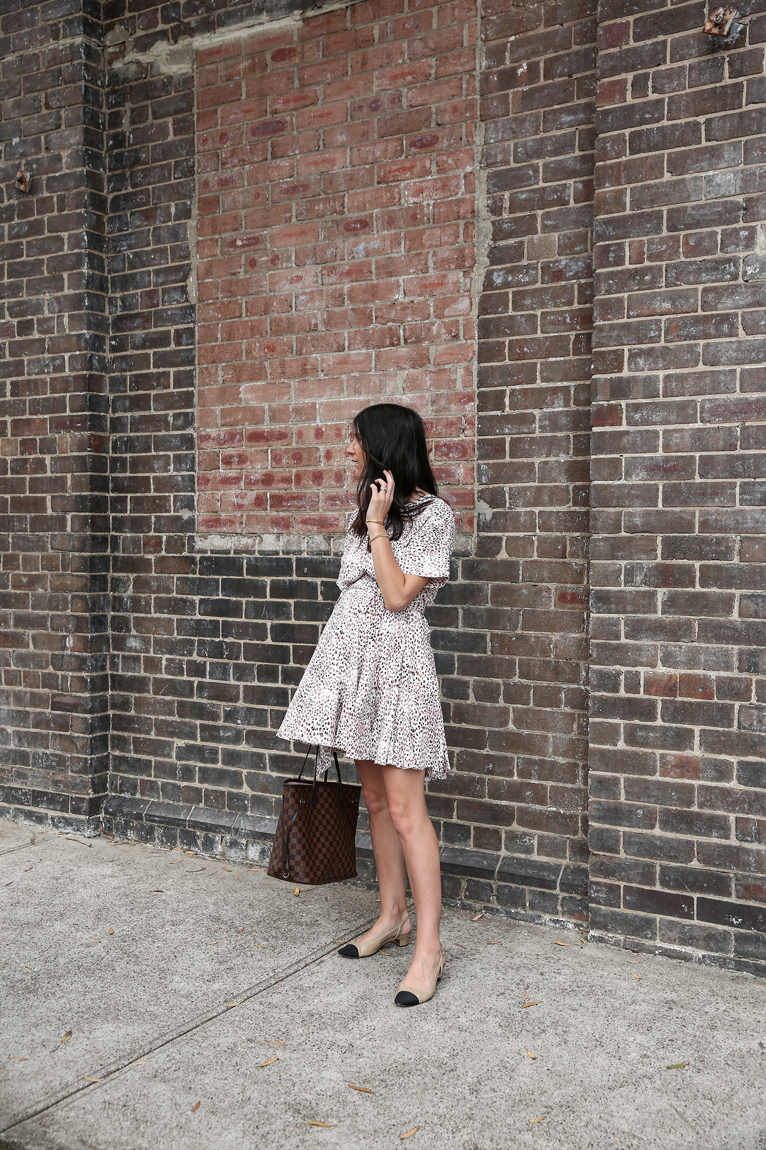 Jamie Lee of Mademoiselle wearing a leopard print dress from Sussan Louis Vuitton Neverfull and Vaneli two tone pumps