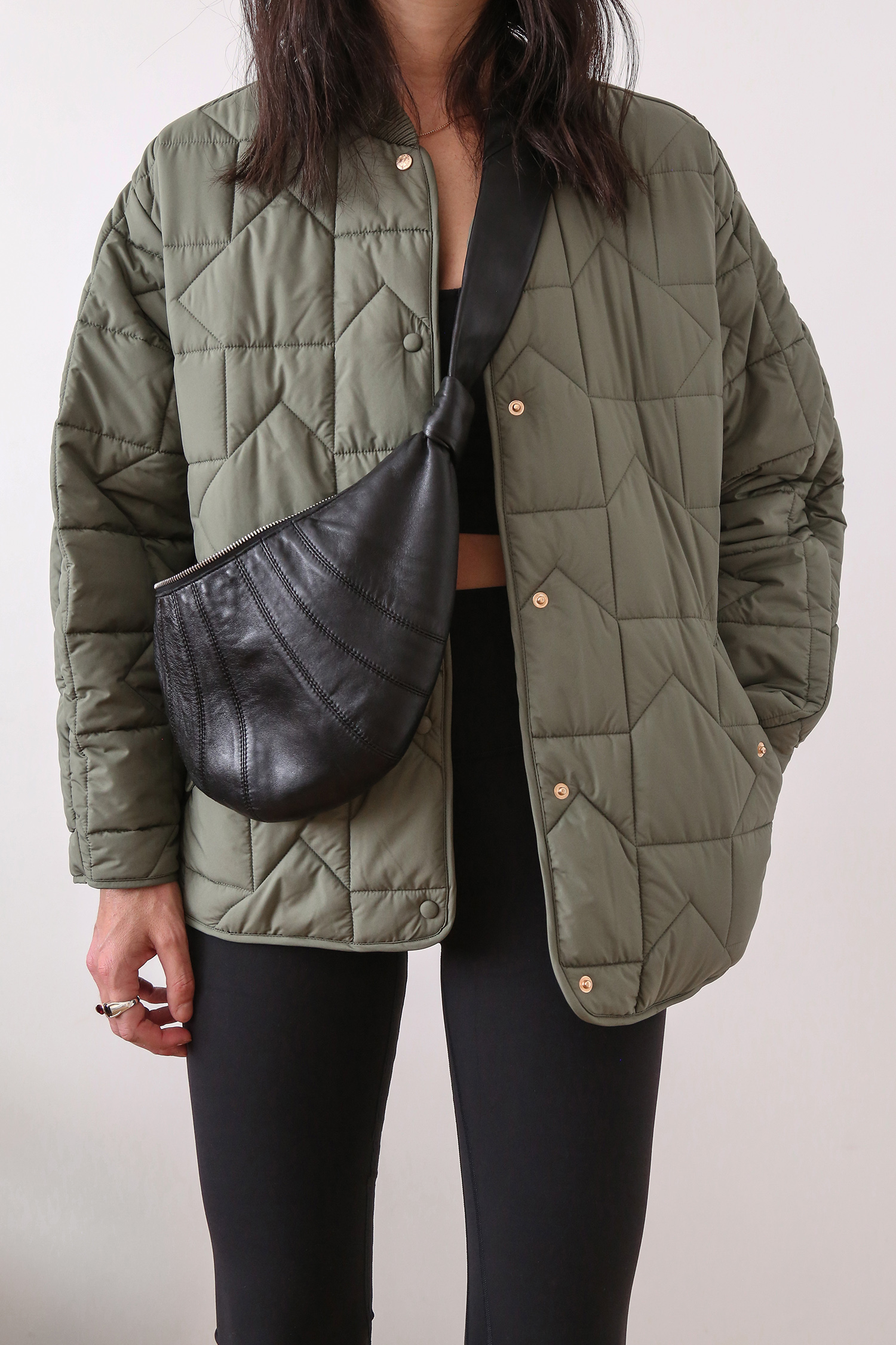 Wearing Karen Walker quilted jacket with Lululemon activewear