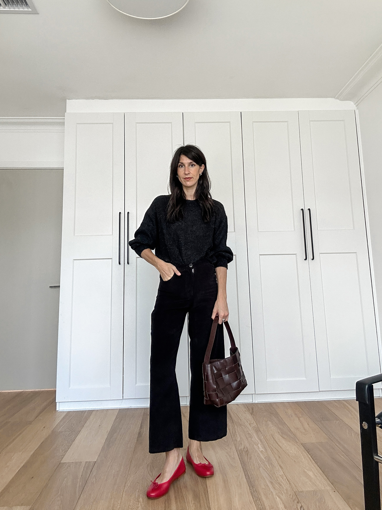 Wearing all black outfit worn with red ballet flats minimalist style
