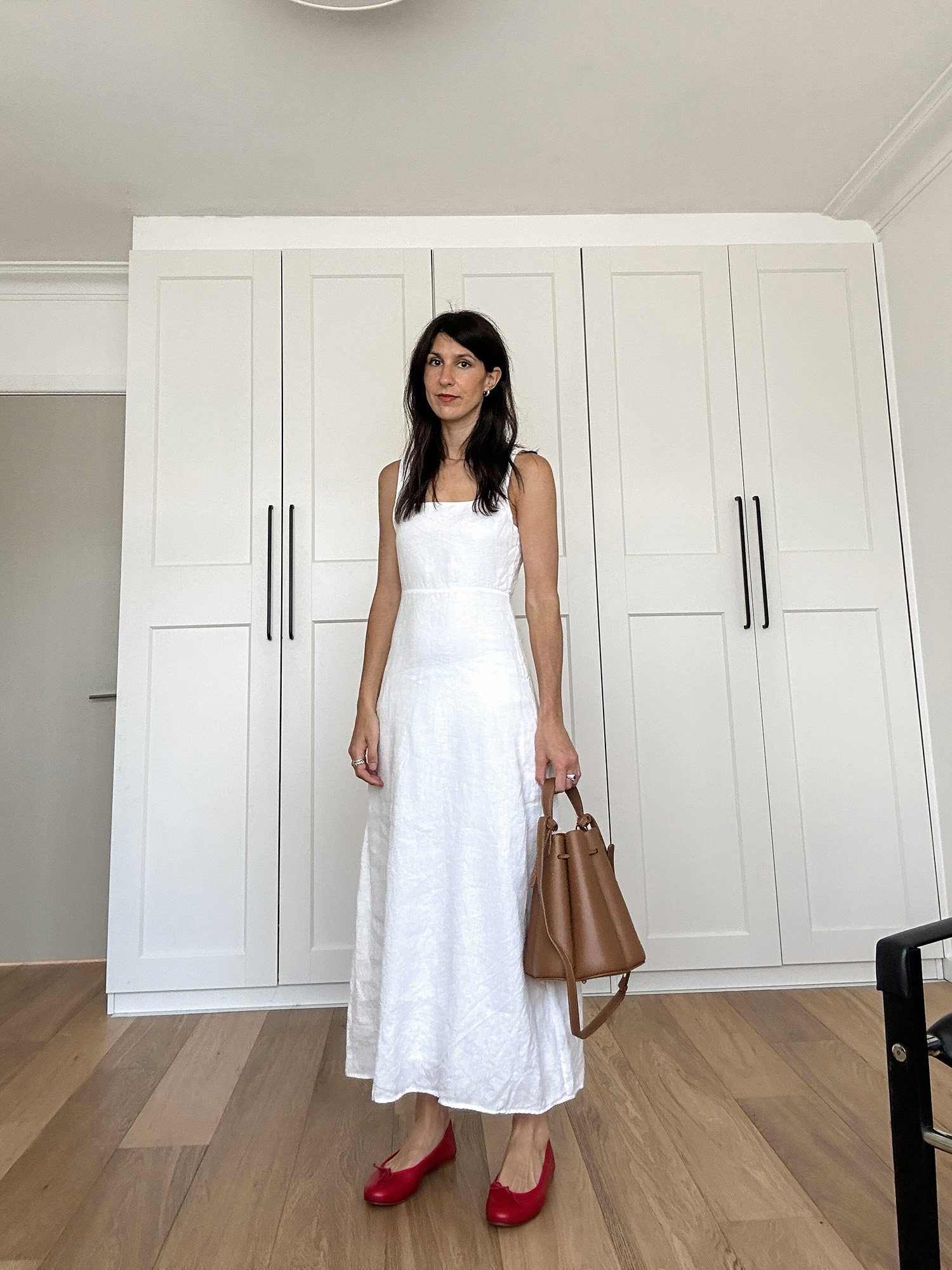 Wearing white dress from DISSH with red ballet flats and Polene bag