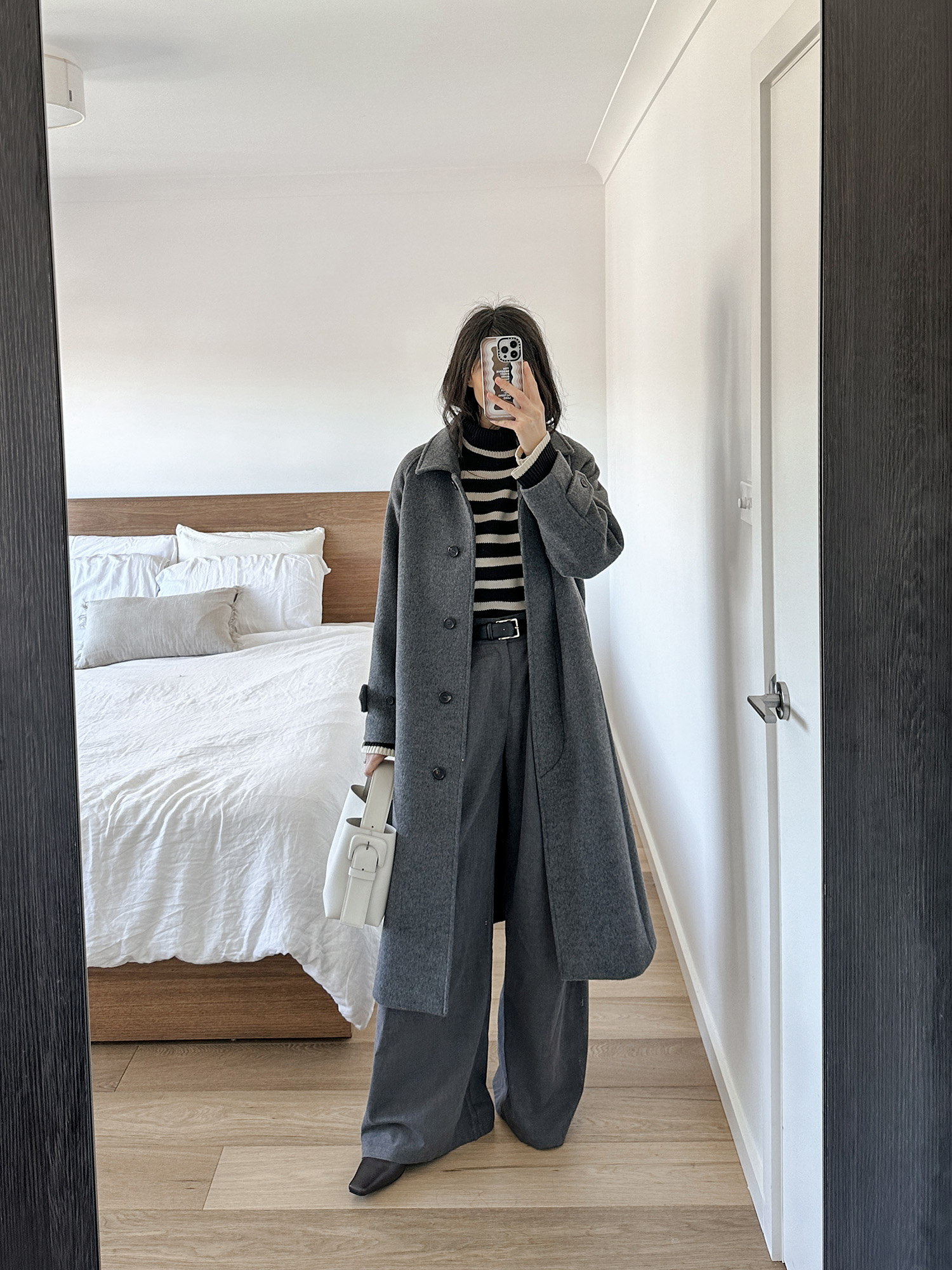 Toteme oversized stripe knit with Dissh harper trousers and AERE label boots