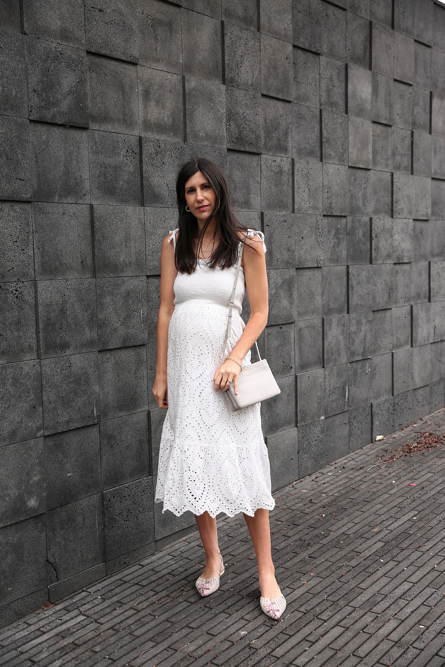 Jamie Lee of Mademoiselle wearing a Farrow broderie anglaise dress and Zimmermann flats