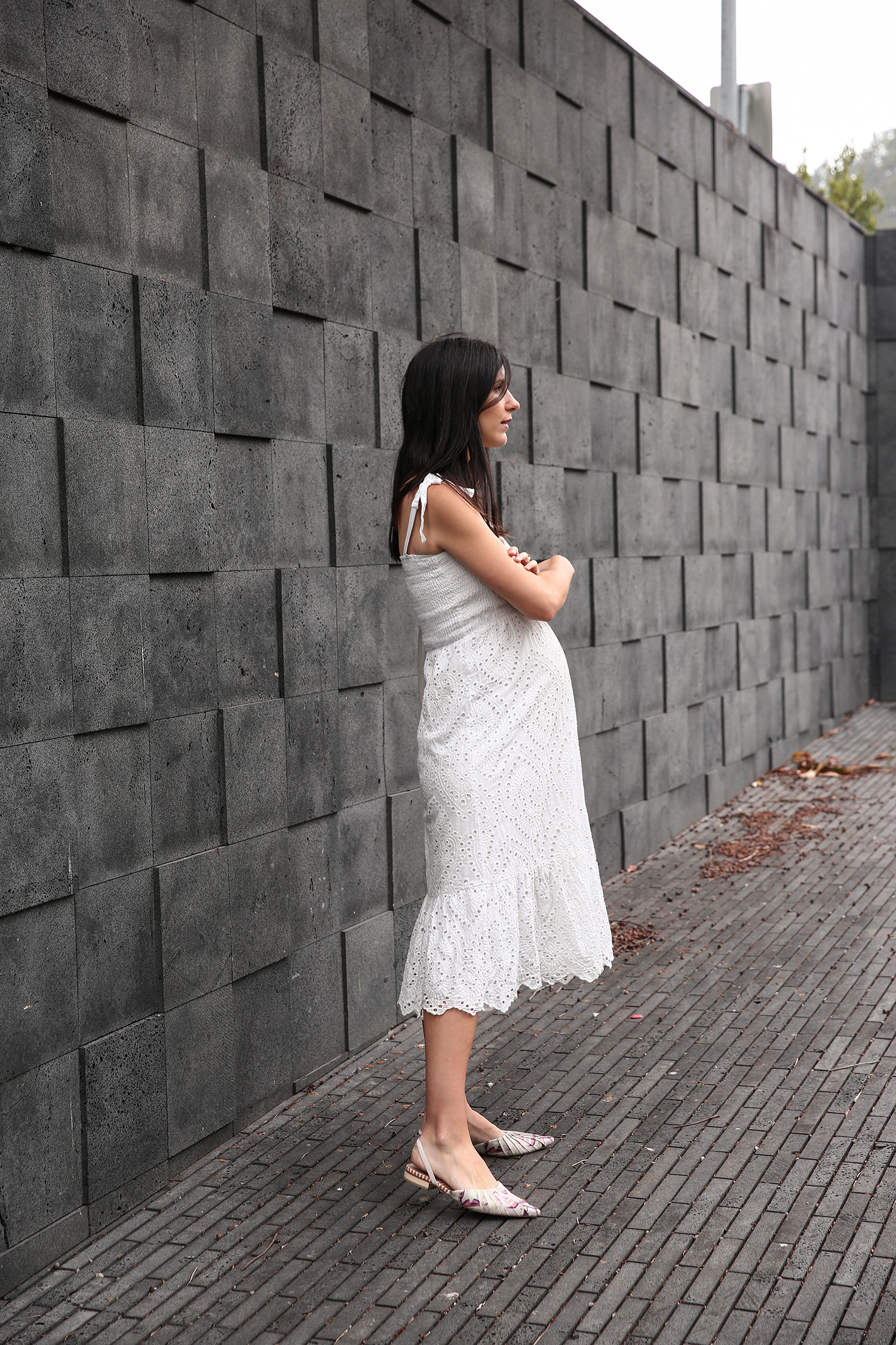 Jamie Lee of Mademoiselle wearing a Farrow broderie anglaise dress and Zimmermann flats