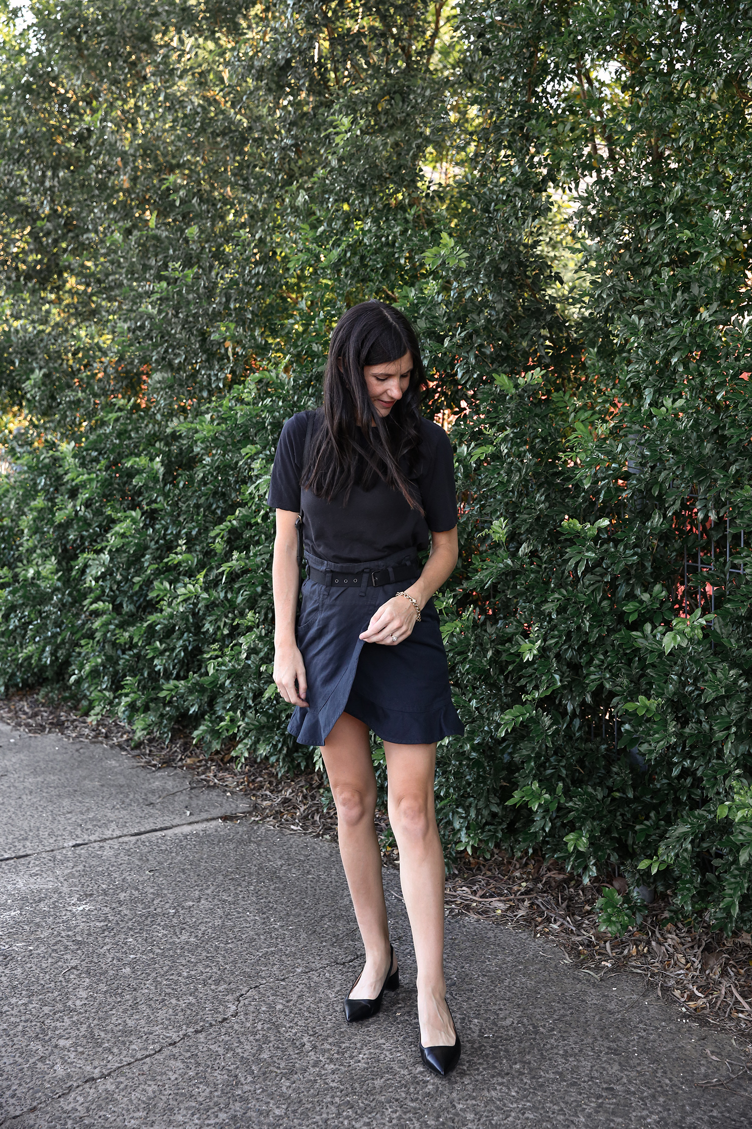 Jamie Lee of Mademoiselle wearing an Everlane black tee and Isabel Marant ruffled skirt