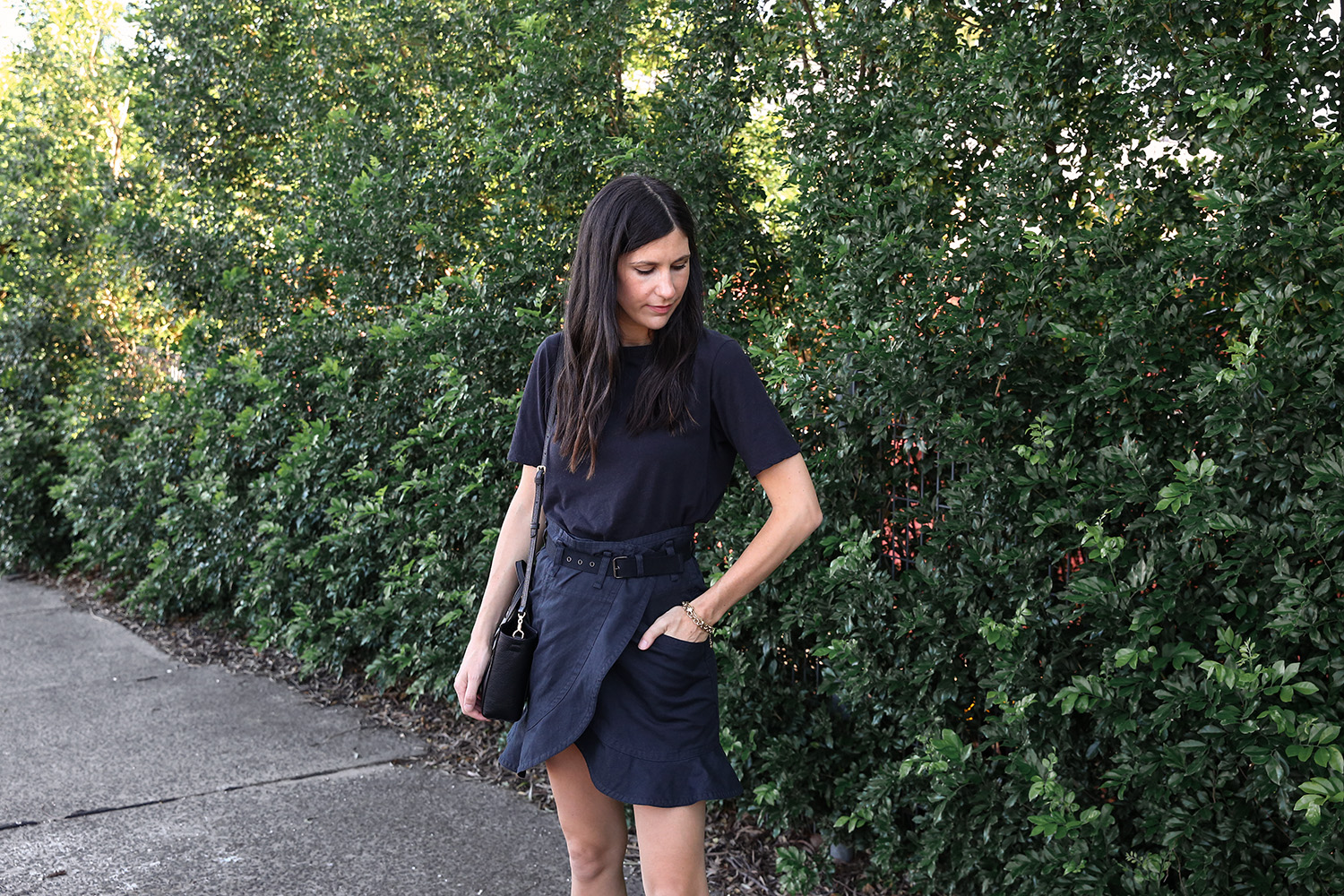 Jamie Lee of Mademoiselle wearing an Everlane black tee and Isabel Marant ruffled skirt