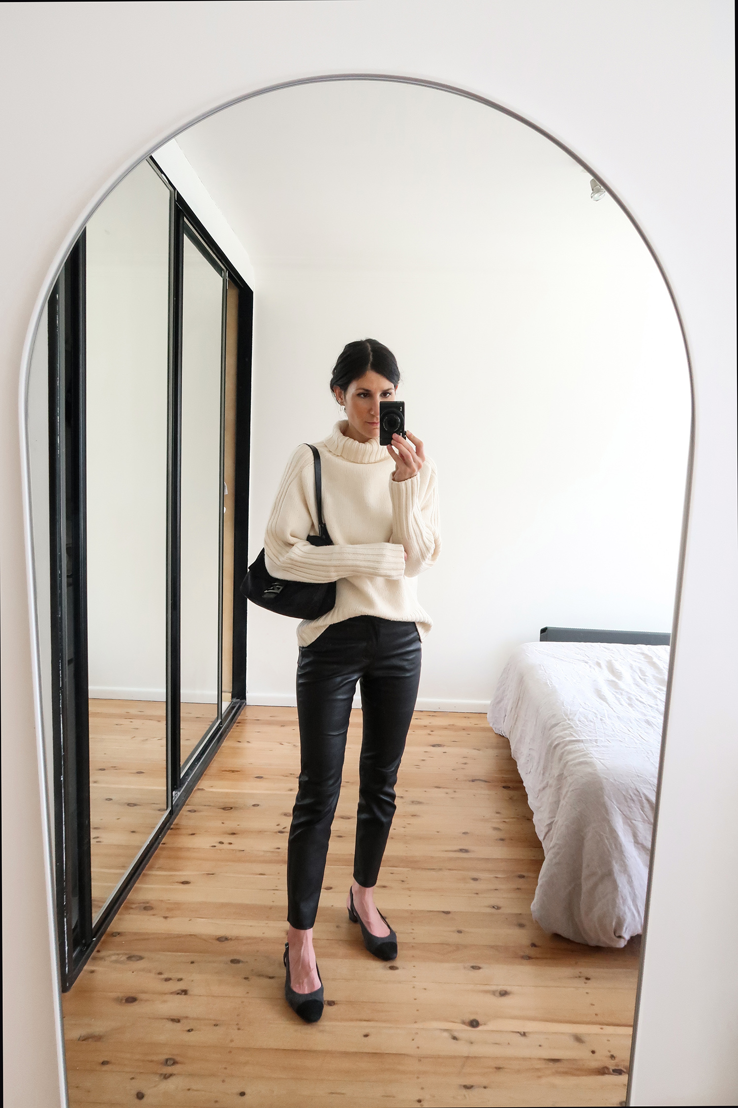 Jamie Lee of Mademoiselle wearing Joseph knit sweater with Grlfrnd leather trousers