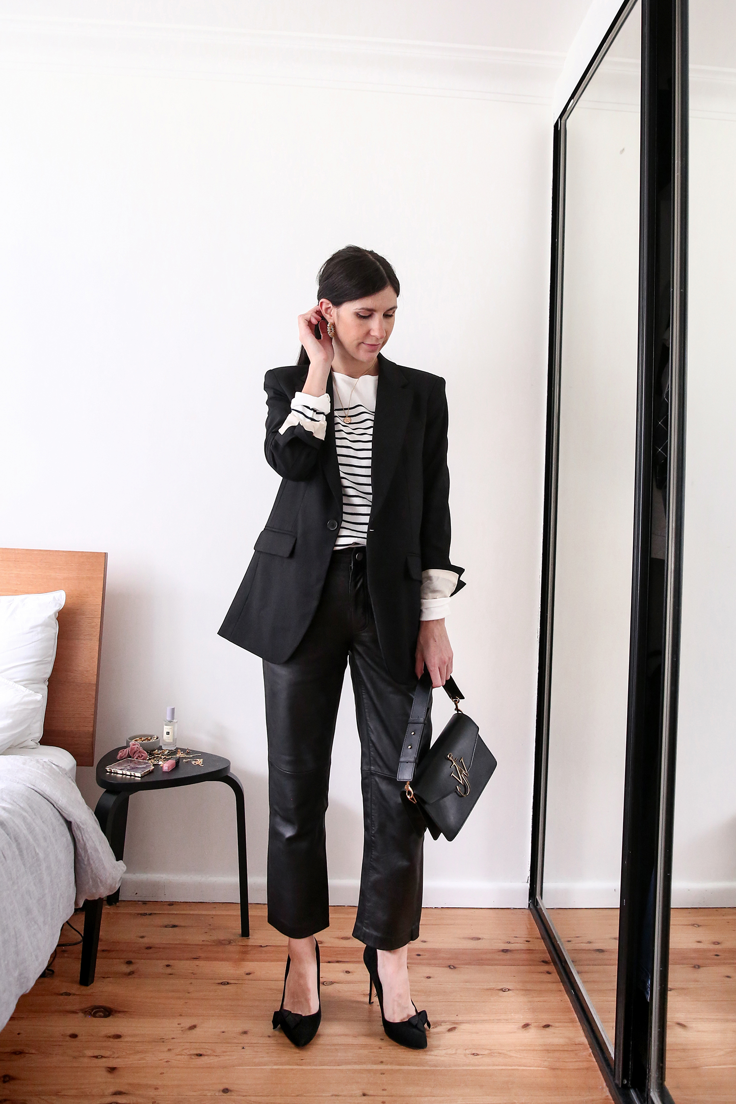 Parisian style outfit with breton striped top leather trousers and black blazer
