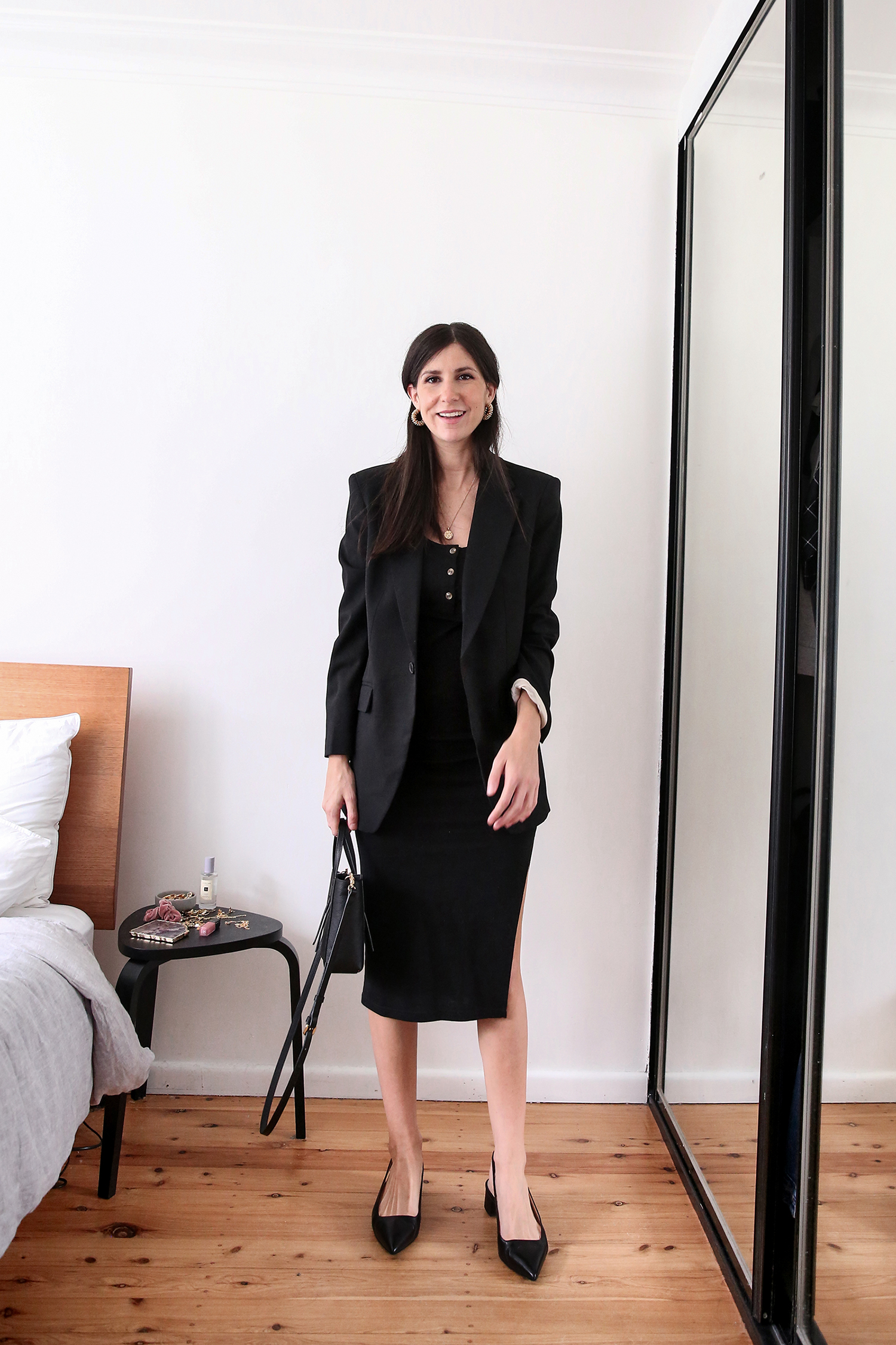 Monochromatic outfit wearing a black fitted dress and oversized black blazer