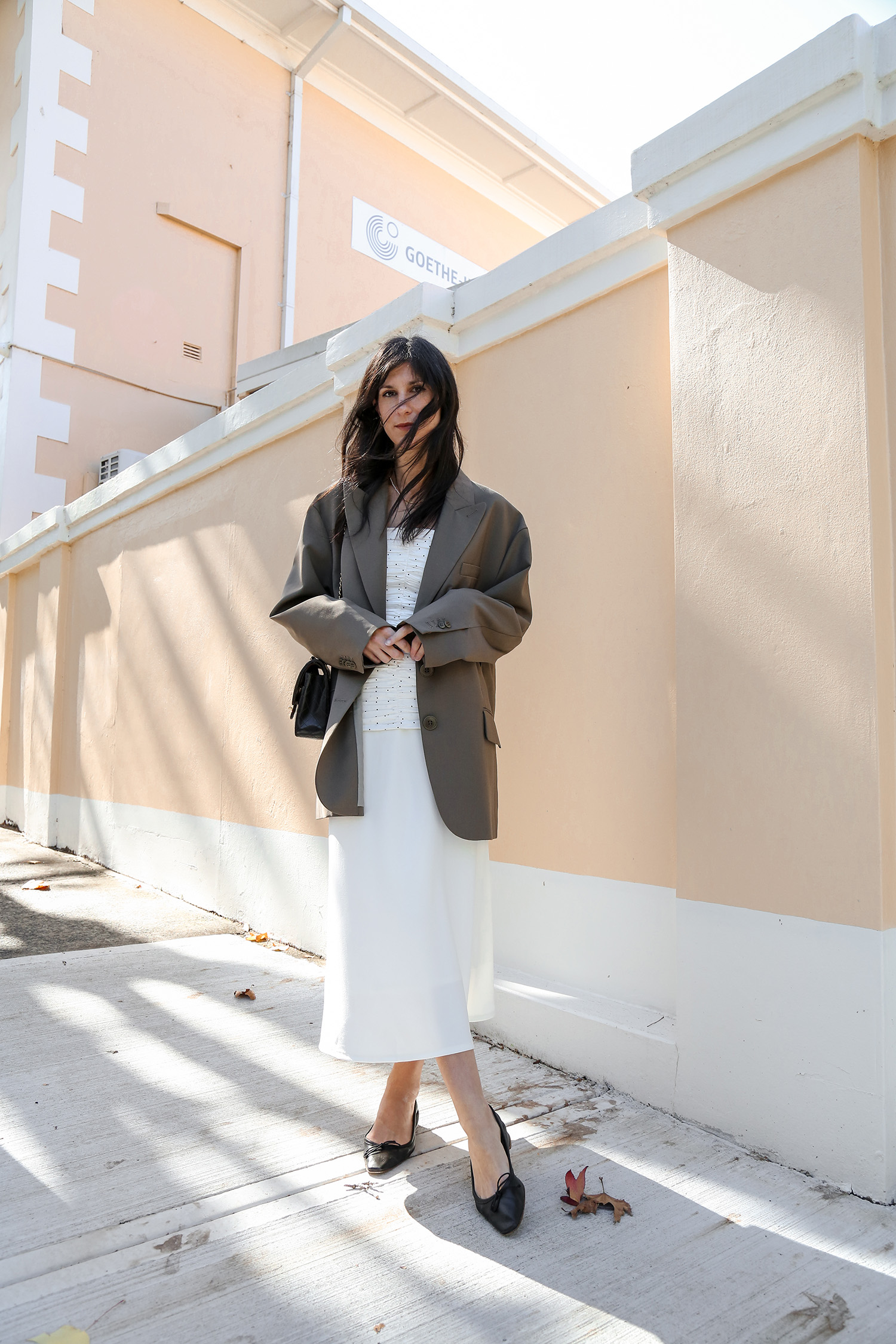Minimal chic Parisian style outfit all white with oversized blazer