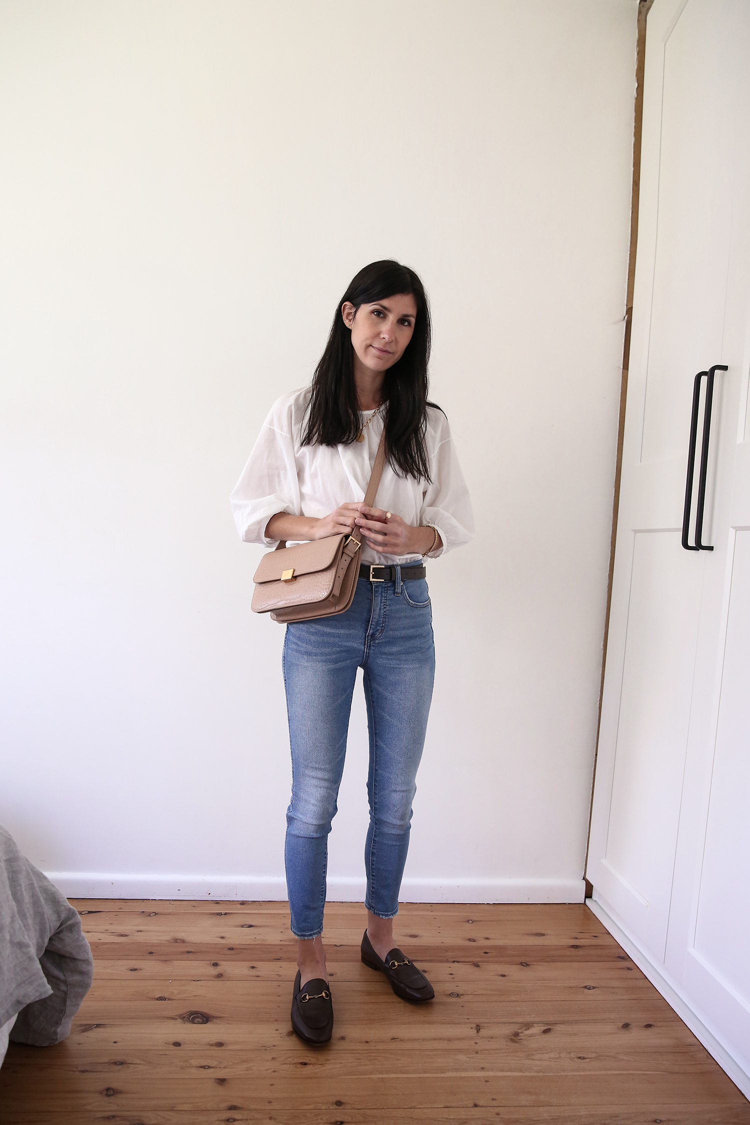 Everlane ruched air blouse and Madewell skinny jeans