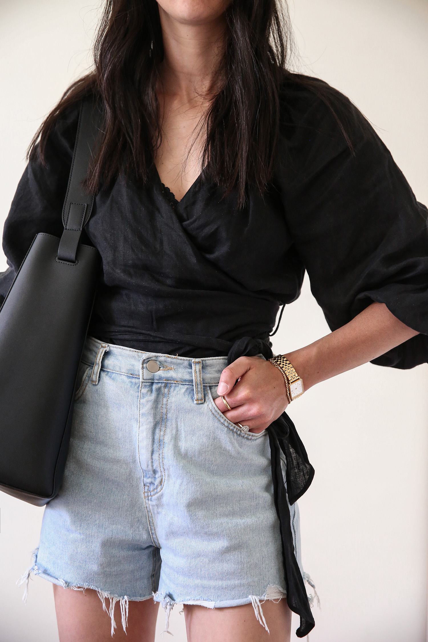 Black wrap top with denim shorts minimal spring outfit