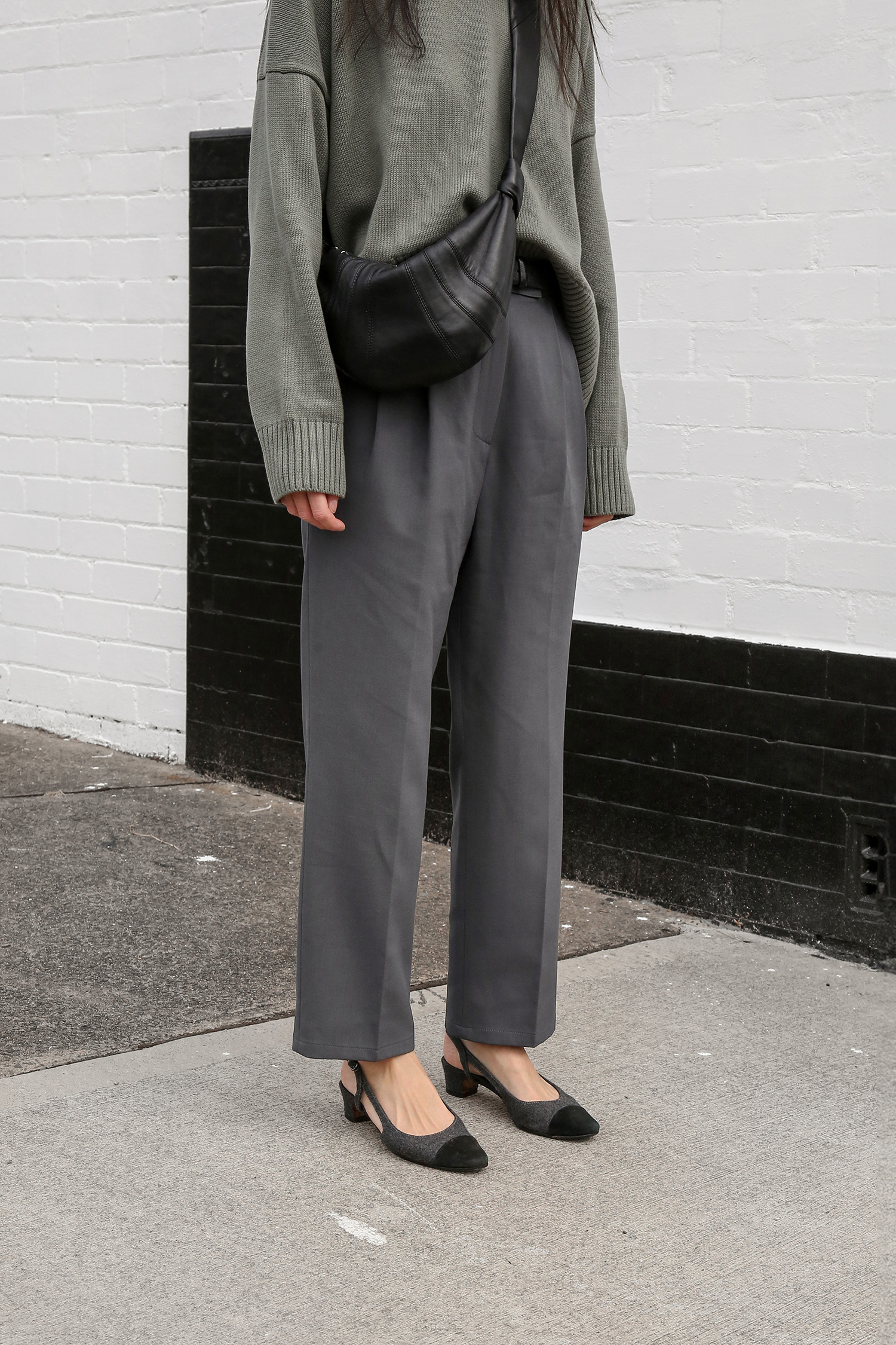 Oversized sweater worn with tapered cropped trousers