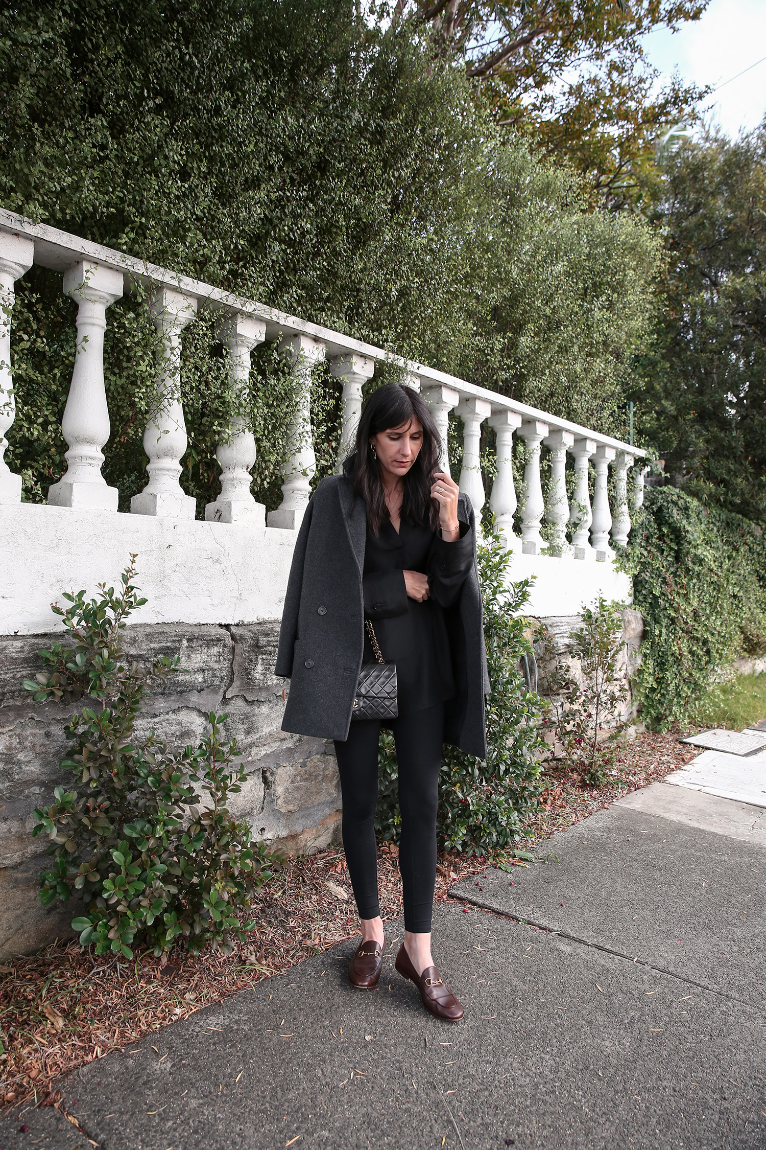 Minimal Style Scandi monochrome outfit wearing COS black silk kaftan and Gucci Loafers