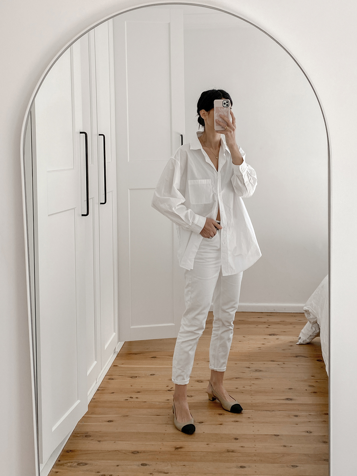 minimal monochrome all white outfit wearing Moia shirt and Everlane cheeky jeans