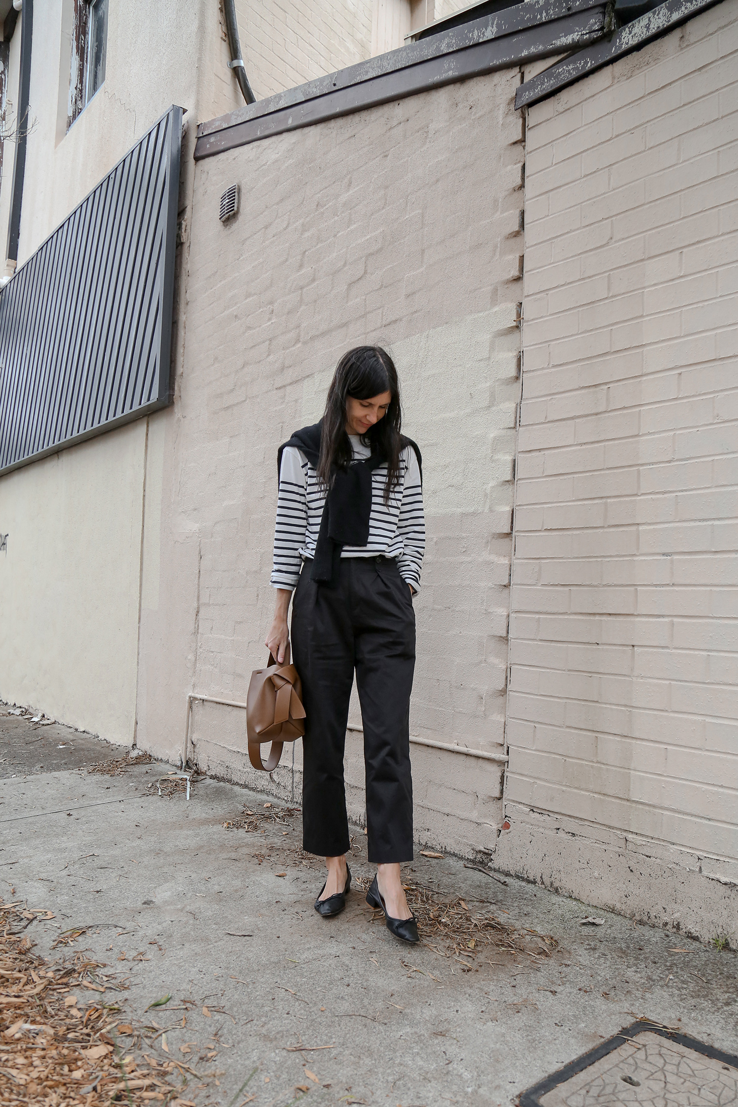 Classic Parisian Chic Style outfit with breton stripe top and black trousers