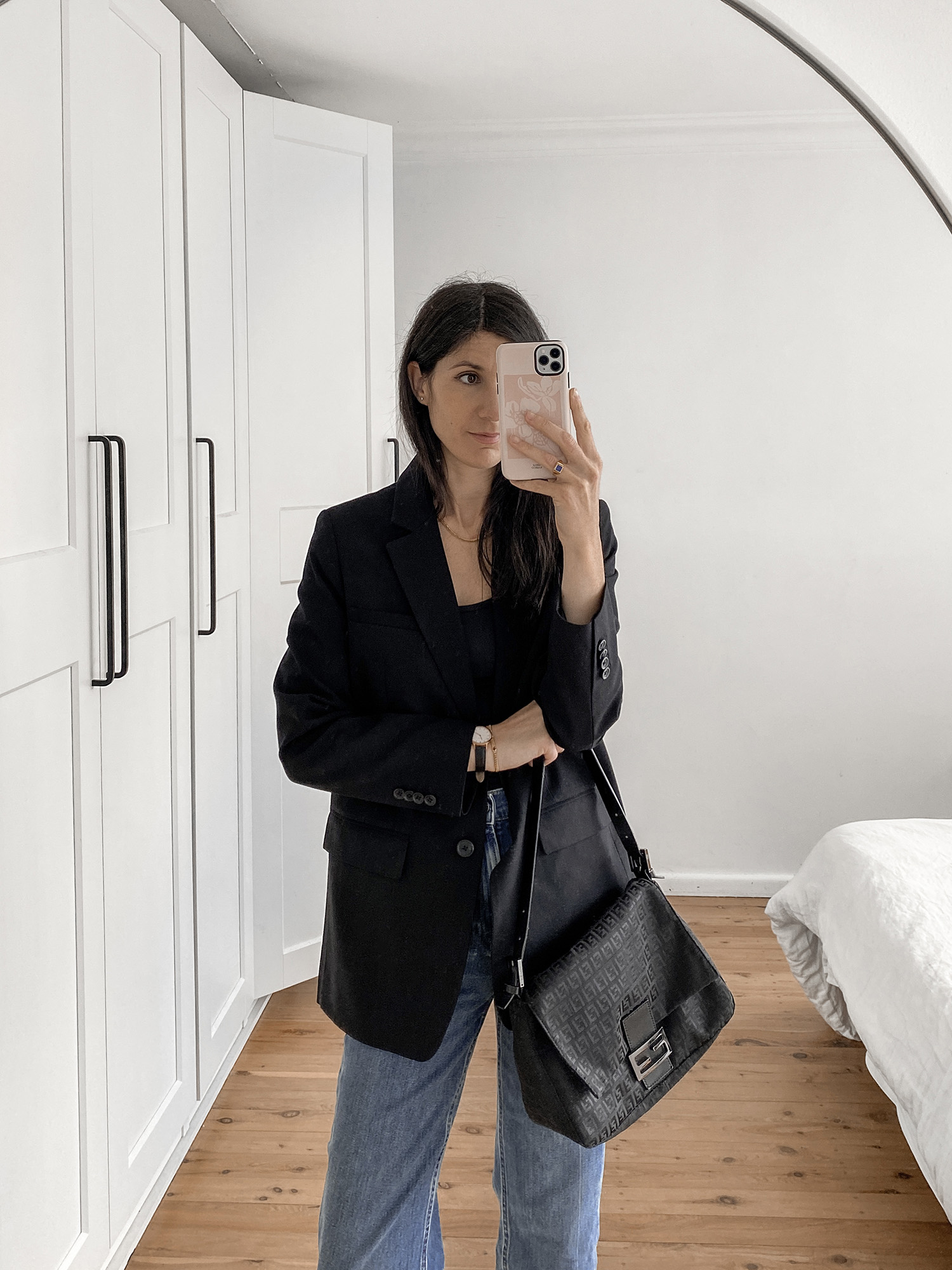 minimal outfit wearing Everlane black blazer and way high jeans