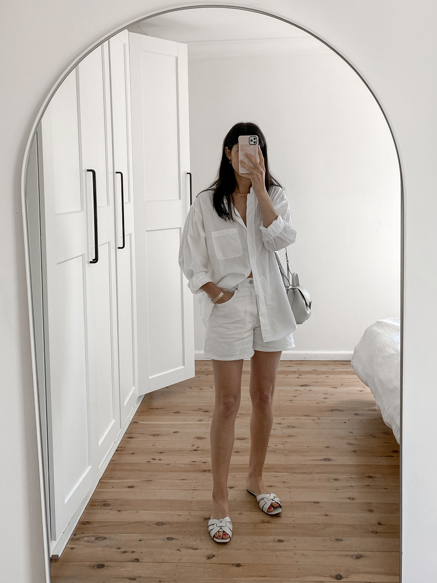 monochrome outfit summer style wearing oversized white shirt and Arket denim shorts