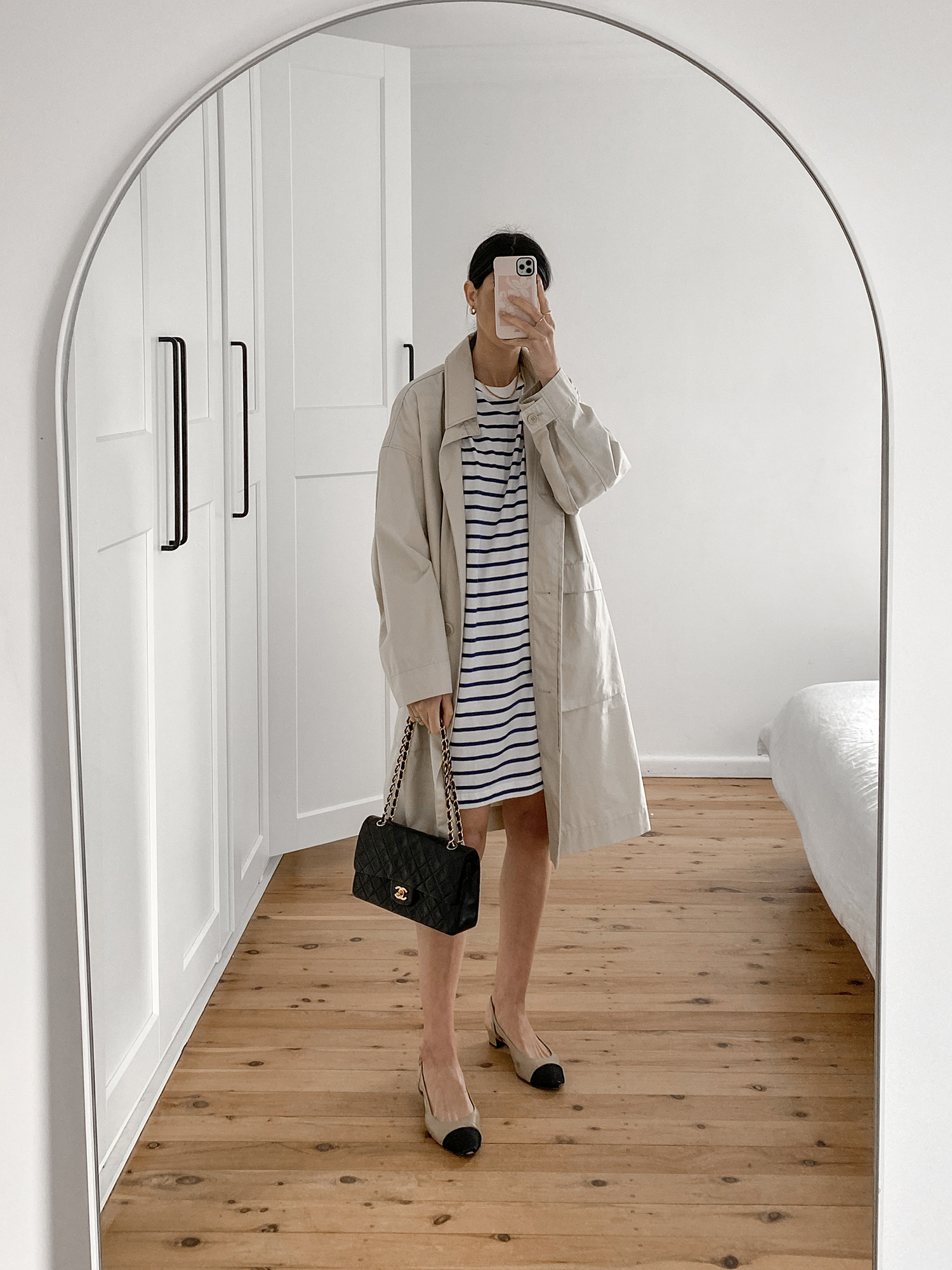 Parisian chic outfit wearing Breton stripe mini dress and trench coat